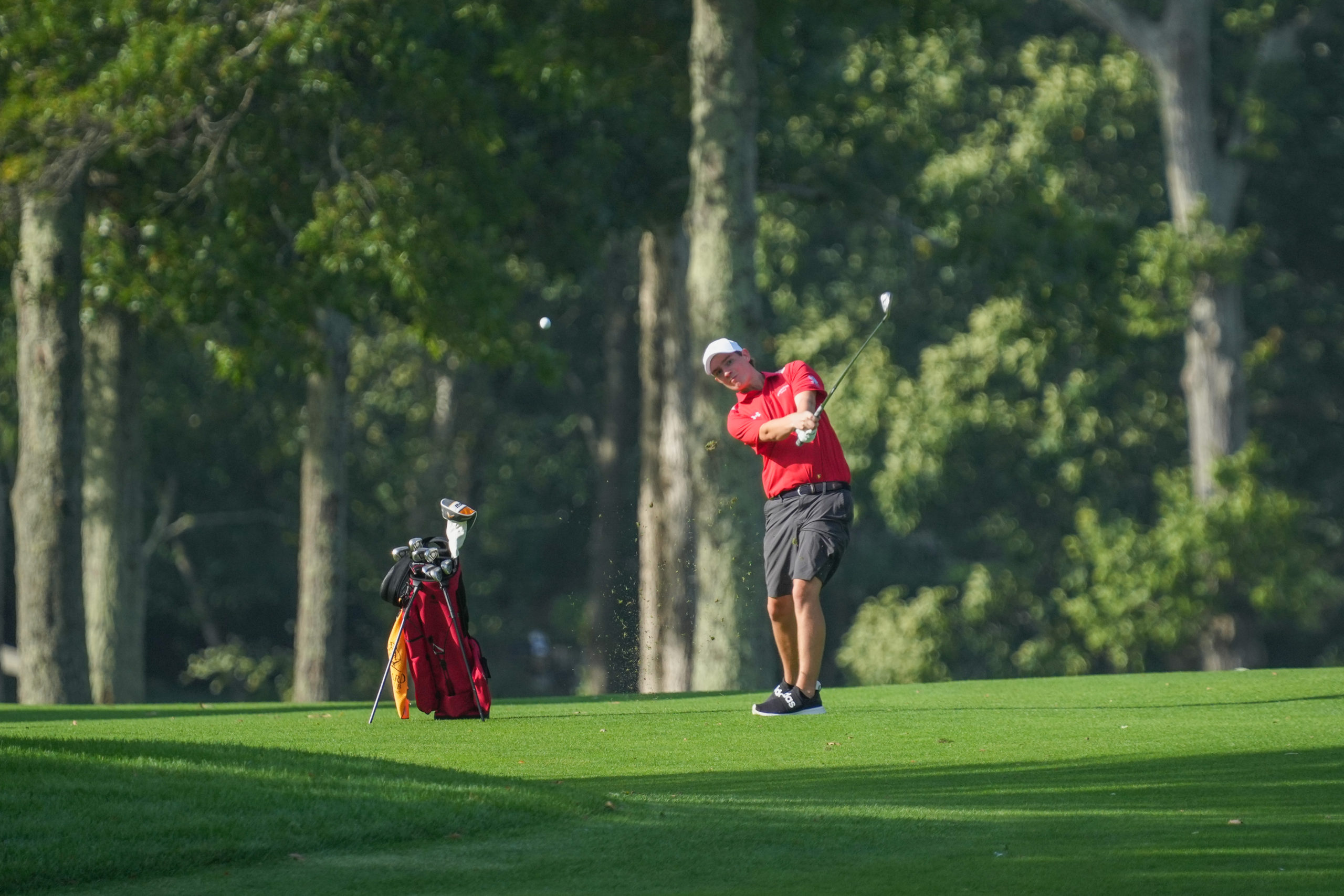 Carter Kleinsmith drives a ball off the green for Pierson.