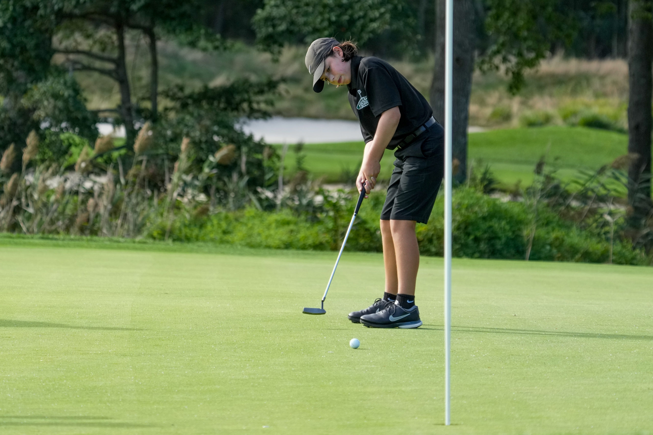 Westhampton Beach eighth-grader Zach Berger putts.