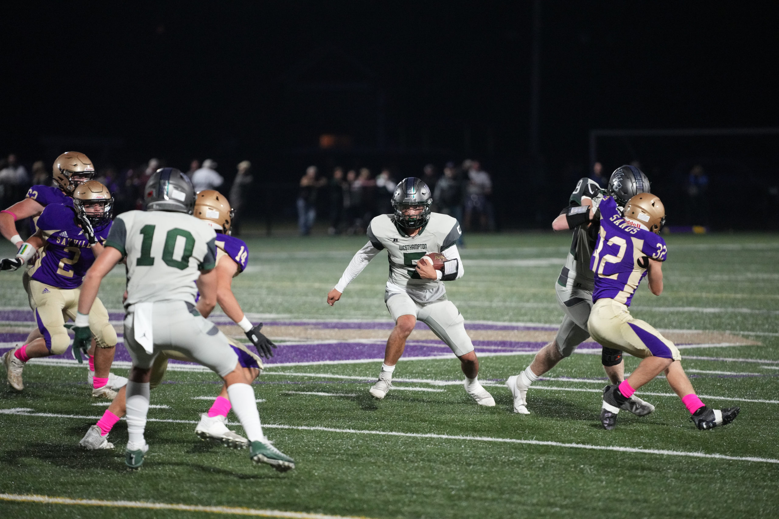 Westhampton Beach senior quarterback Geoff Arrasate looks to make a play.