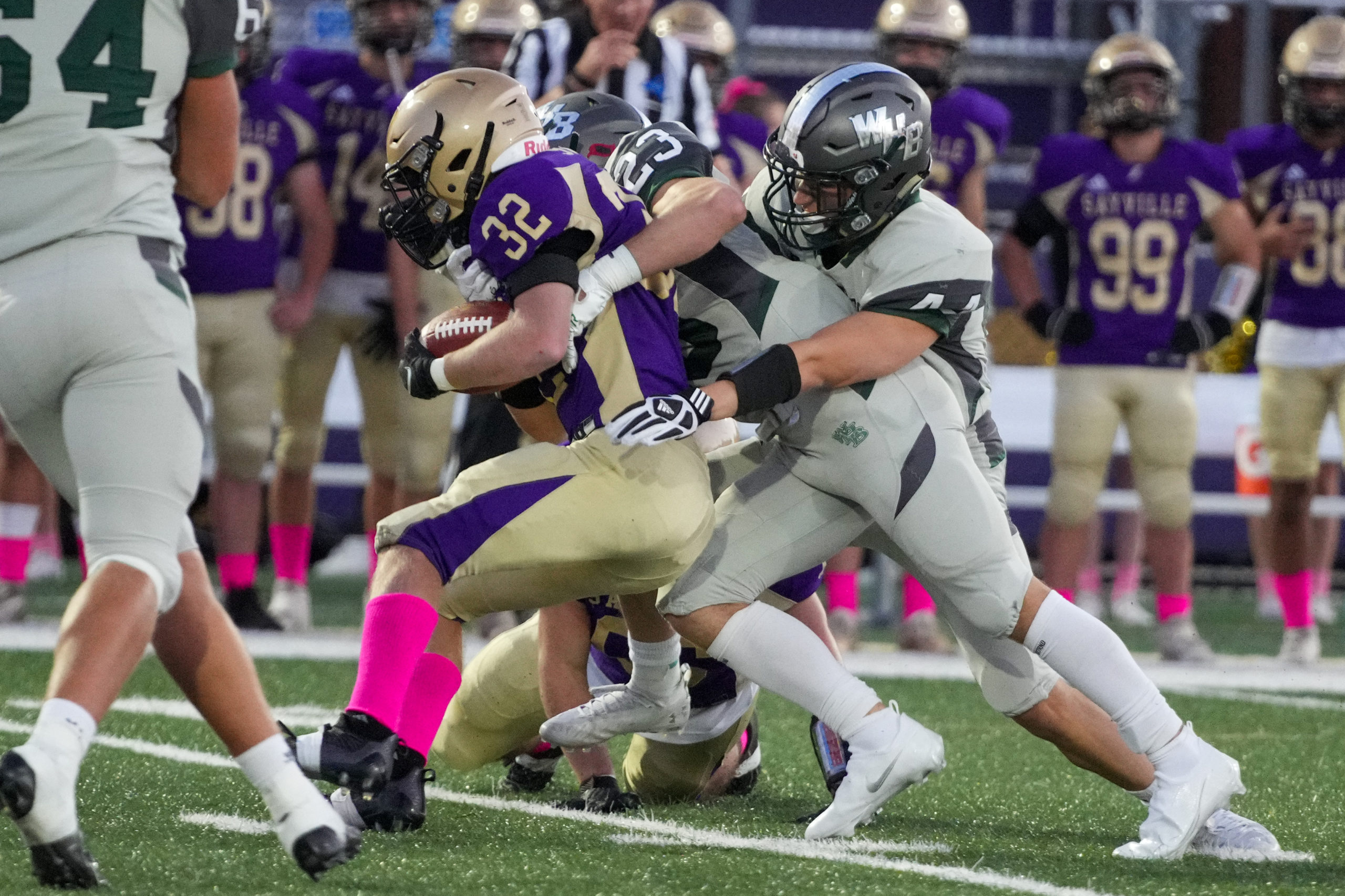 Westhampton Beach senior Rob Moreland and Luke Donahue take down Sayville's Charlie Sands.  RON ESPOSITO