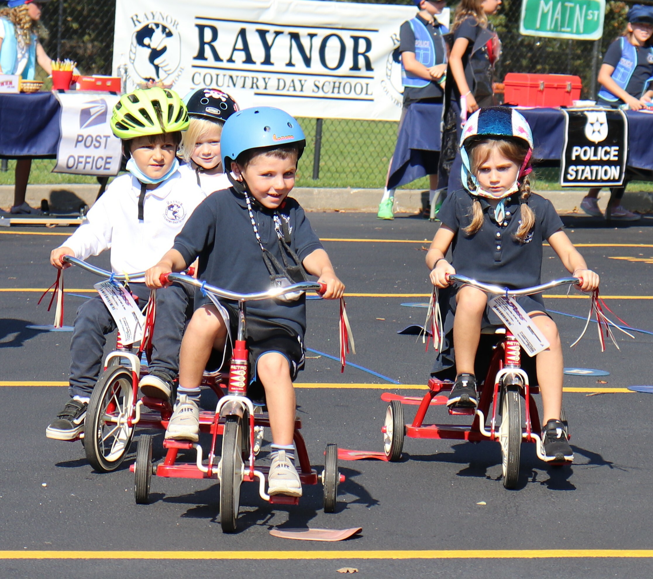Raynor Country Day School held its annual Tykes on Bikes- Safety Town event last week, during which Southampton Town Police Officer Eric Plum posed with his fellow 