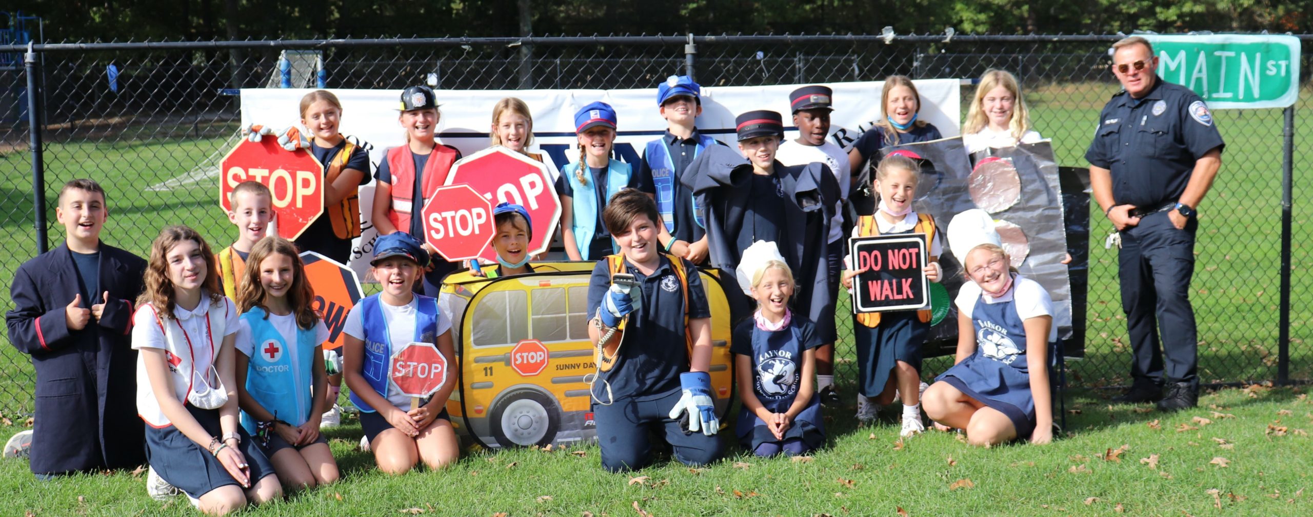 Raynor Country Day School held its annual Tykes on Bikes- Safety Town event last week, during which Southampton Town Police Officer Eric Plum posed with his fellow 