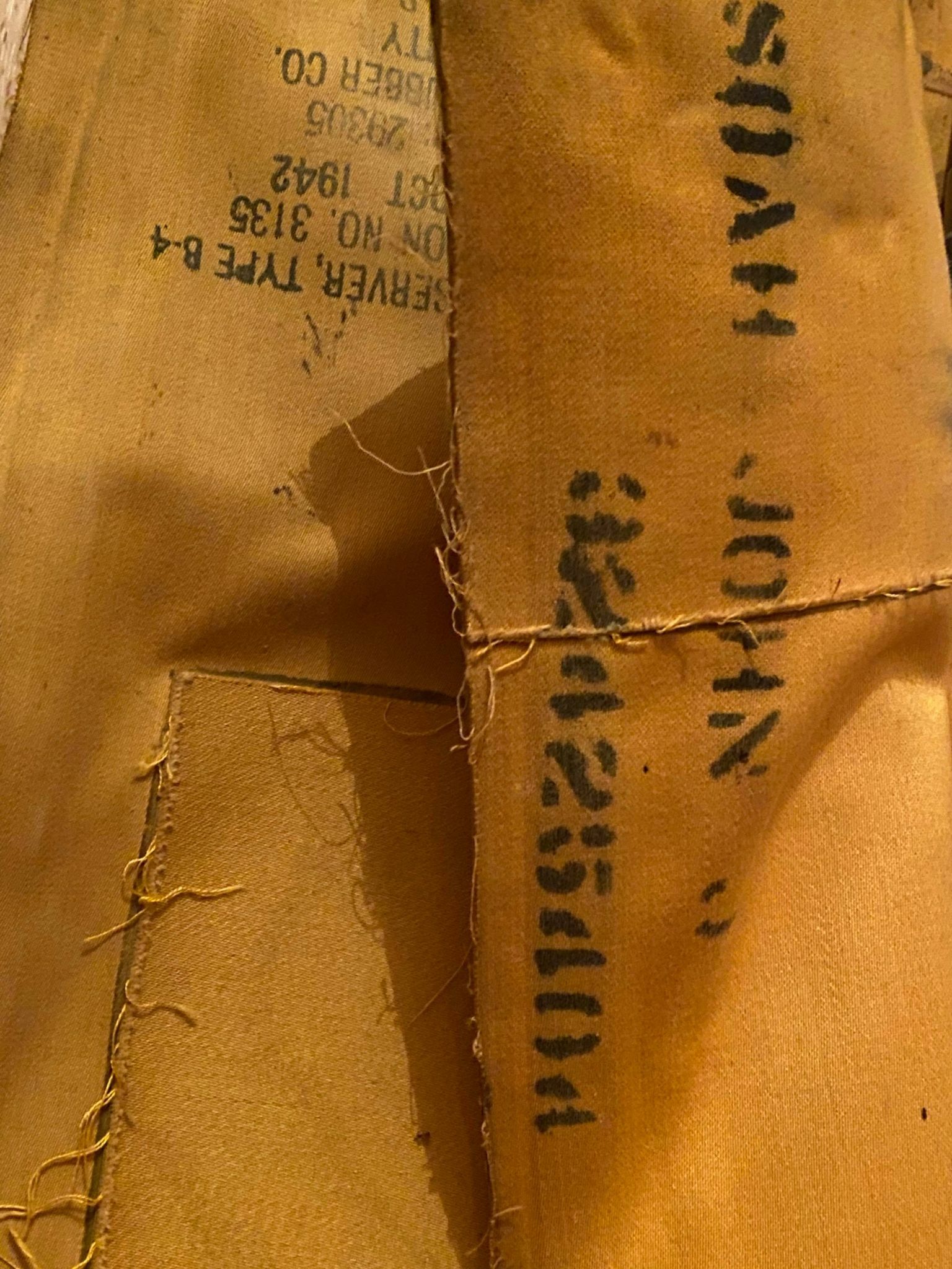 The name John Soah is stenciled on the life jacket.