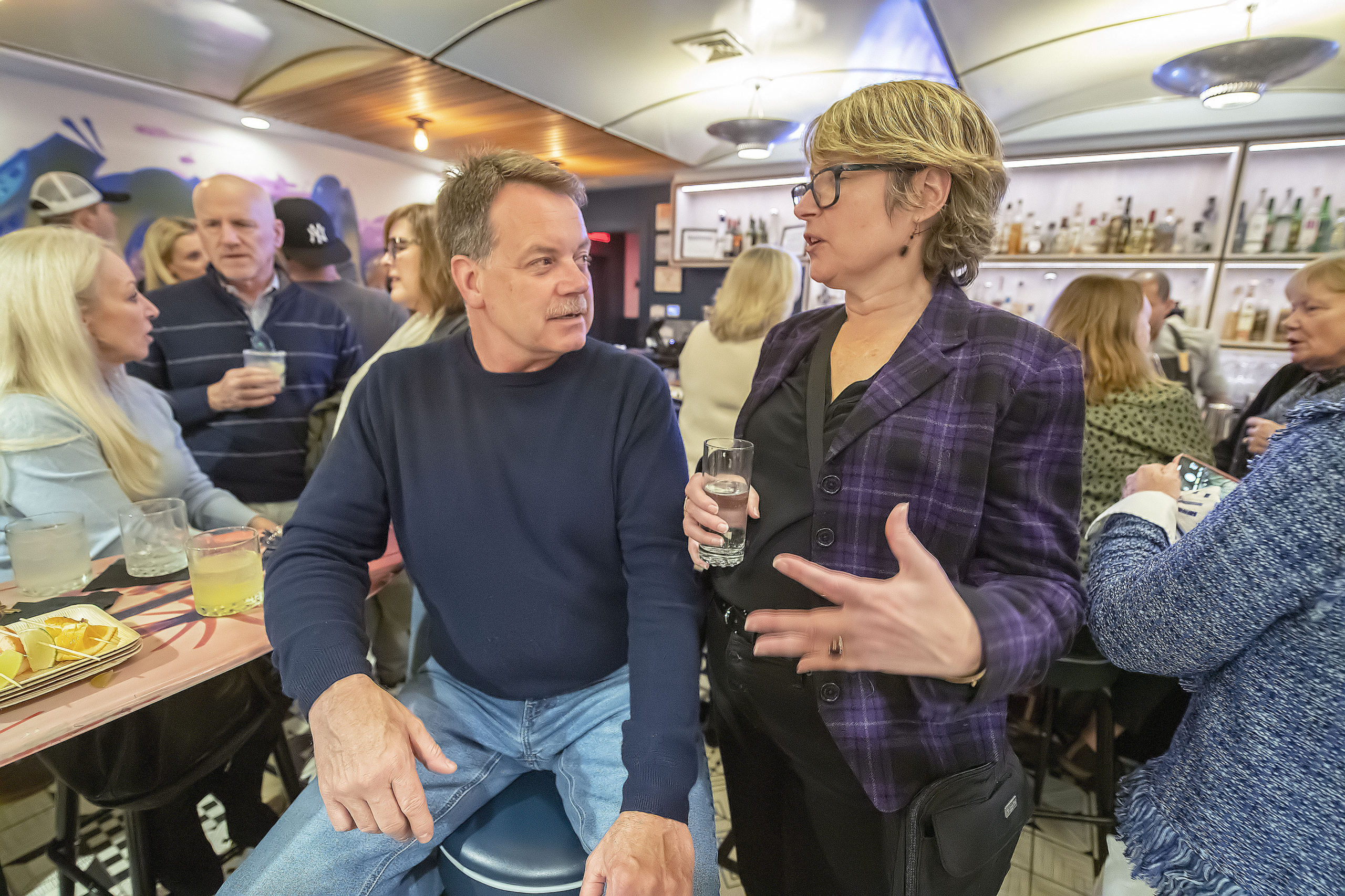 East Hampton Village Mayor Jerry Larsen chats with Town Council candidate Kathee Burke-Gonzalez at the Democratic post-election gathering at the Coche Comidor restaurant in Amagansett on Tuesday night.  MICHAEL HELLER