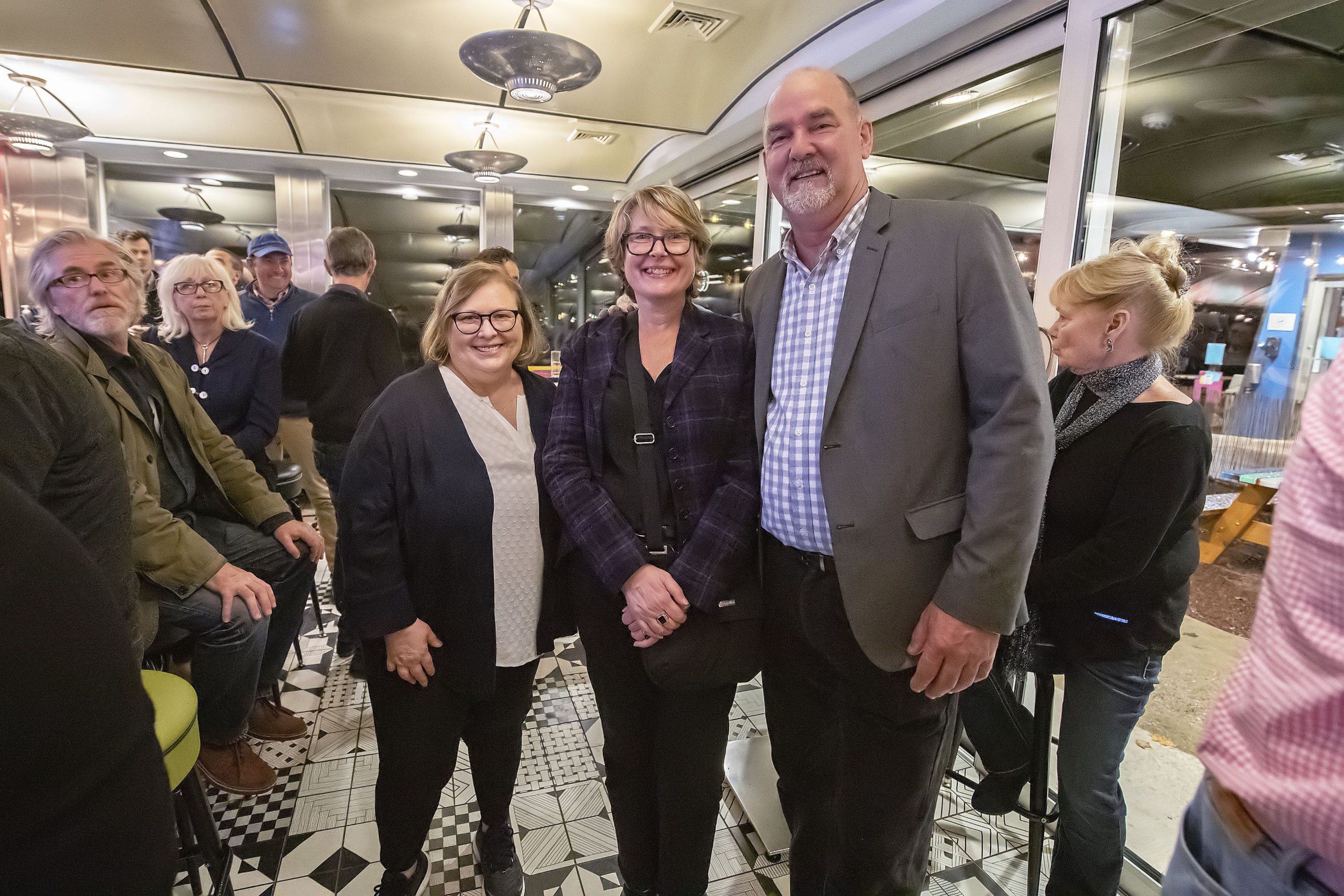 East Hampton Town Council candidates Cate Rogers and Kathee Burke-Gonzalez with Town Supervisor Peter Van Scoyoc at the Democratic post-election gathering at the Coche Comidor restaurant in Amagansett on Tuesday night.   MICHAEL HELLER