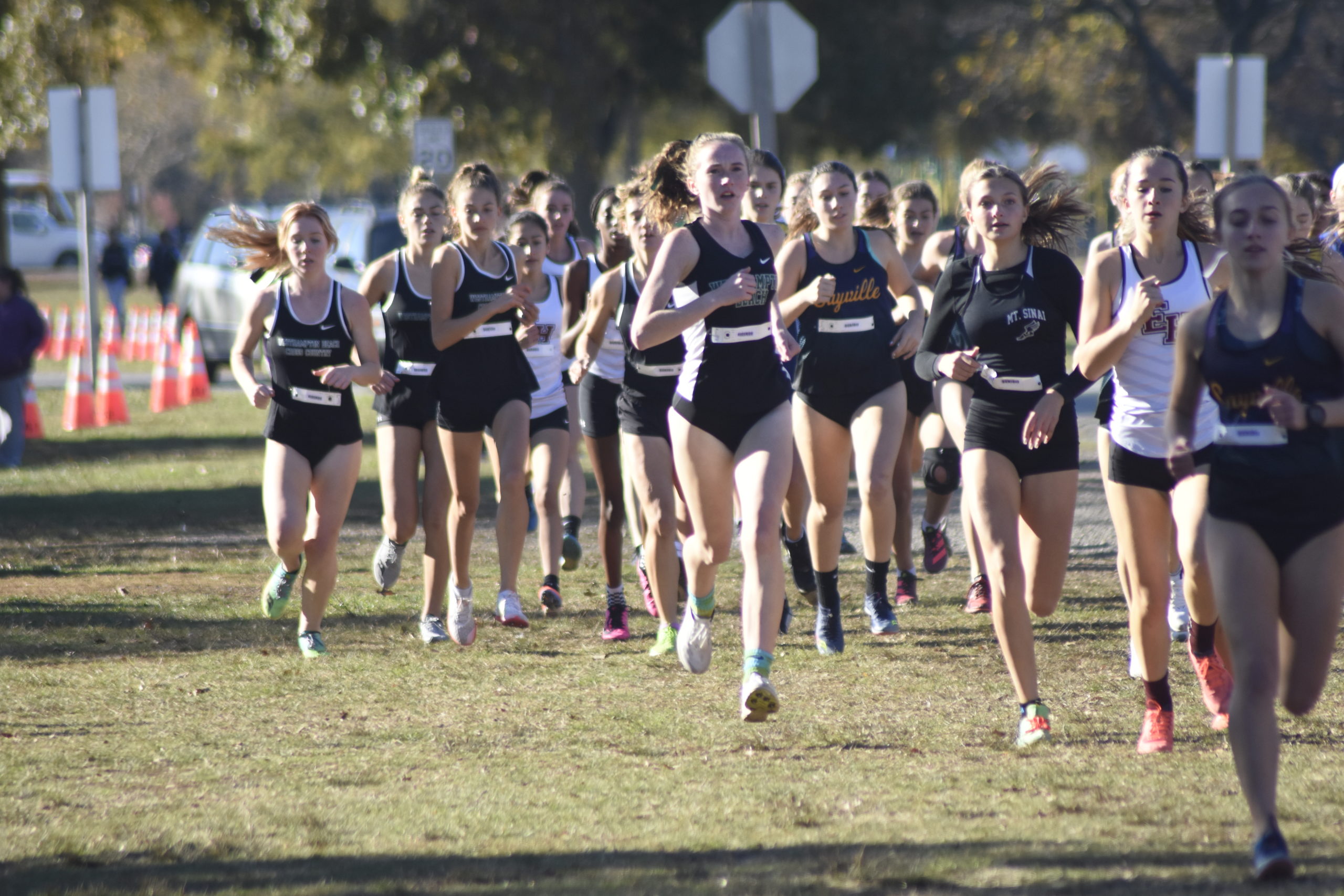 Hurricane Oona Murphy runs with the front of the pack at the start of the girls Class B race.