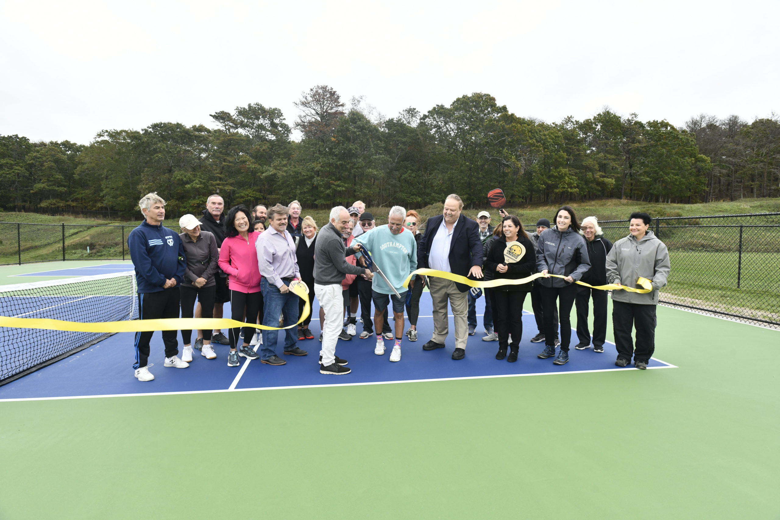 Southampton Town Supervisor Jay Schneiderman and Vinnie Mangano cut the ribbon on the new pickleball courts at North Sea Community Park on October 27.  DANA SHAW