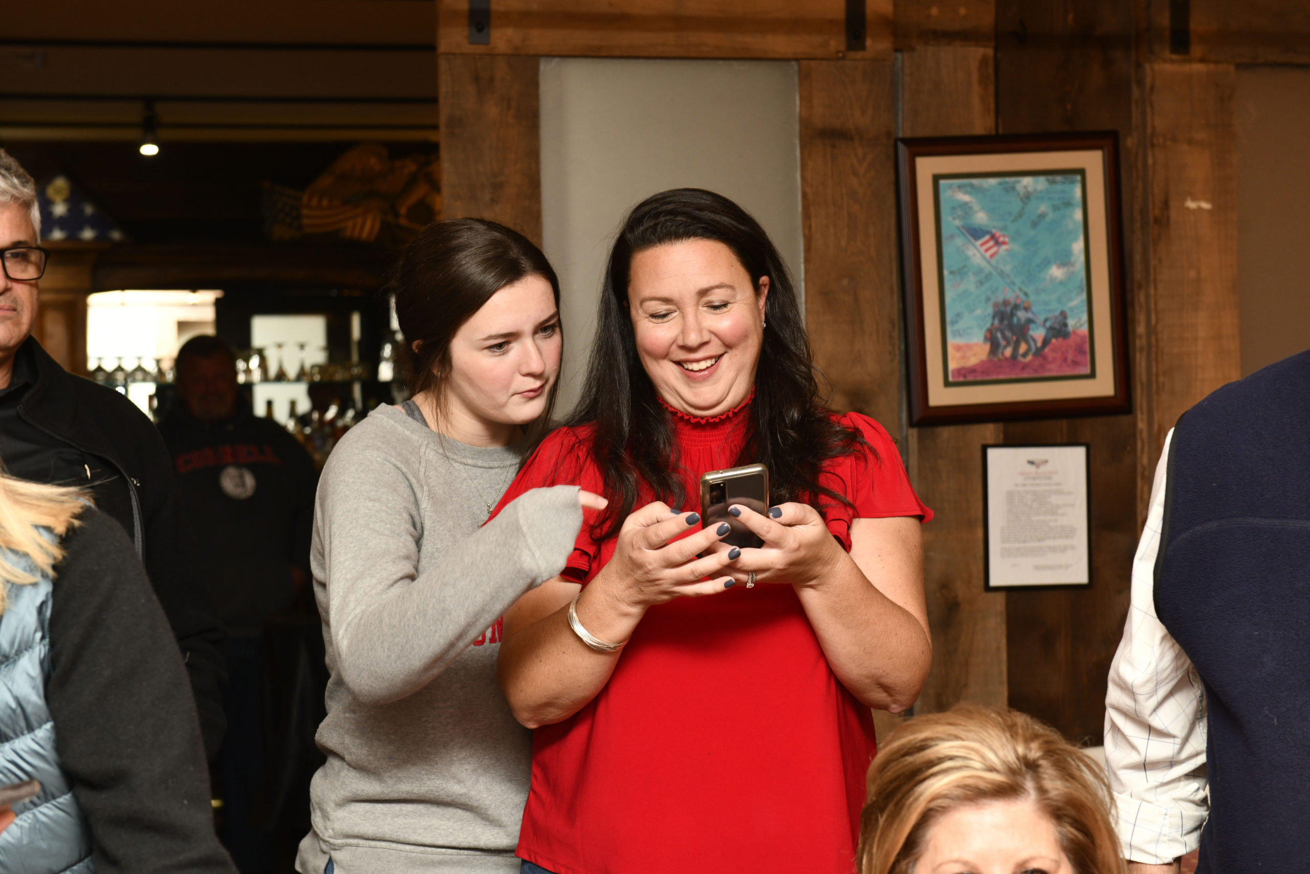 Cynthia McNamara checks results with the daughter, Taylor.  DANA SHAW