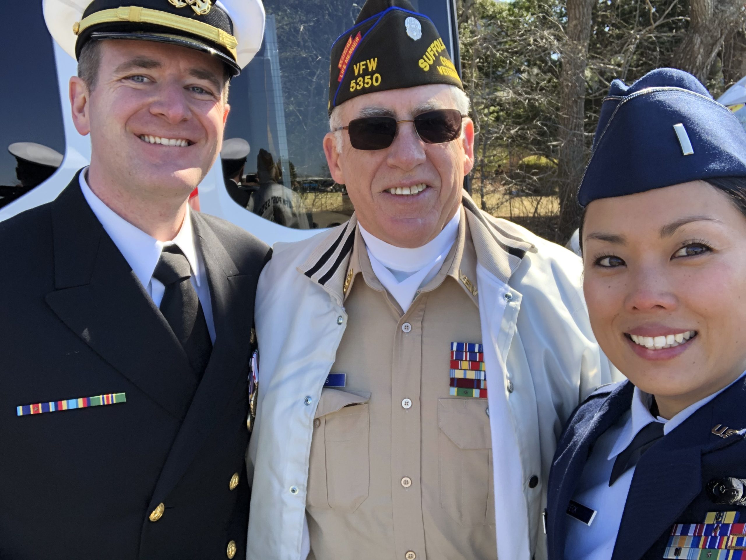Scribner with VFW Post 5350 Commander Bill Hughes and Air Force officer Tia Beck of the 106th Rescue Wing at the Westhampton Beach St Patrick's Day Parade in 2019.