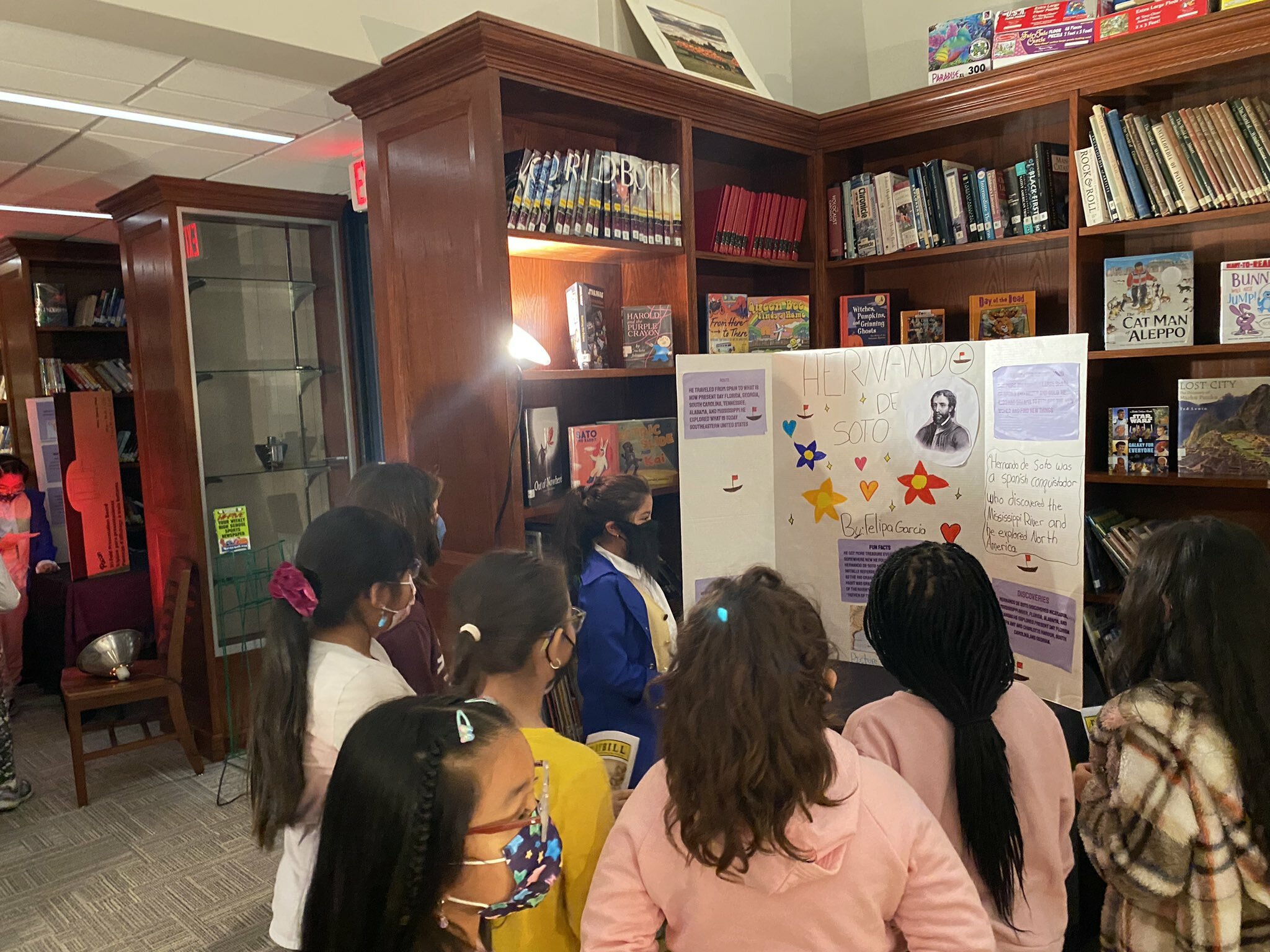 Students gather around an exhibit at the Bridgehampton School's fifth grade wax museum.