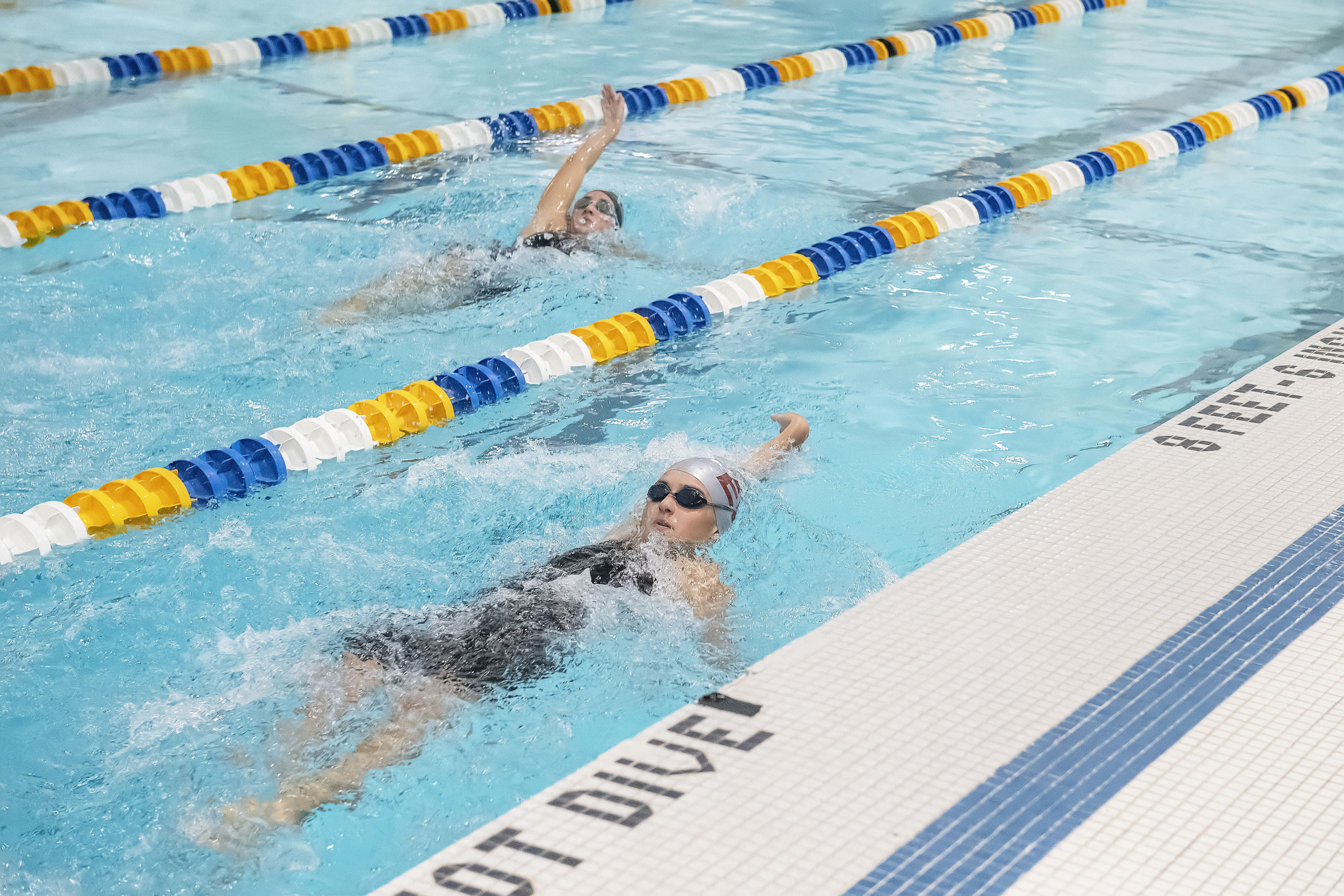 East Hampton's Camryn Hatch swims the backstroke leg of the 200-yard individual relay.