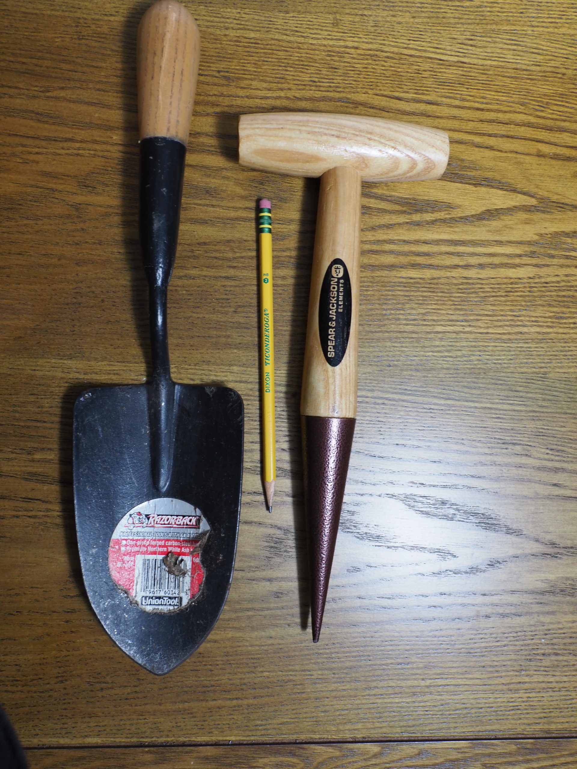 Every gardener should have a garden trowel (left) that won’t bend or break and will last for years. On the right is a T-style garden dibble or dibbler that comes in handy during spring and fall planting times.