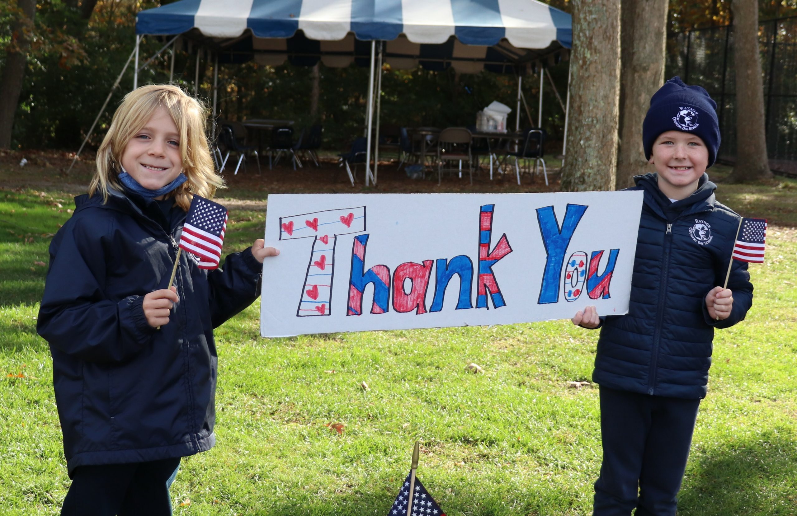 Raynor Country Day School honored  local veterans on November 4 with a drive-through celebration.  Visitors to the campus enjoyed the sights and sounds of the patriotic event which also featured hand-made decorations by the students.  Guests were also greeted by the Westhampton Beach Fire Department, the Eastport Fire Department, the Southampton Town Police Department, and the Patriot Guard Riders.  At the conclusion of the event, all veterans were provided with a complimentary lunch, thank-you card hand crafted by students and a gift.  COURTESY RAYNOR COUNTRY DAY SCHOOL