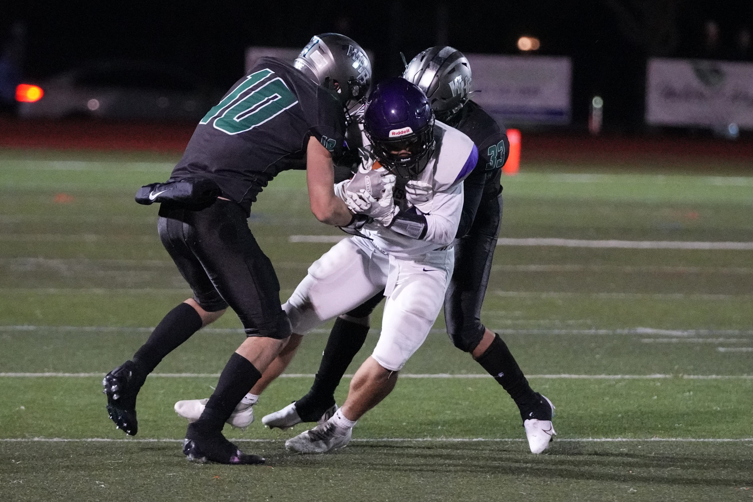 Westhampton Beach senior Christian Killoran and Ethan Faralan wrap up an Islip player.