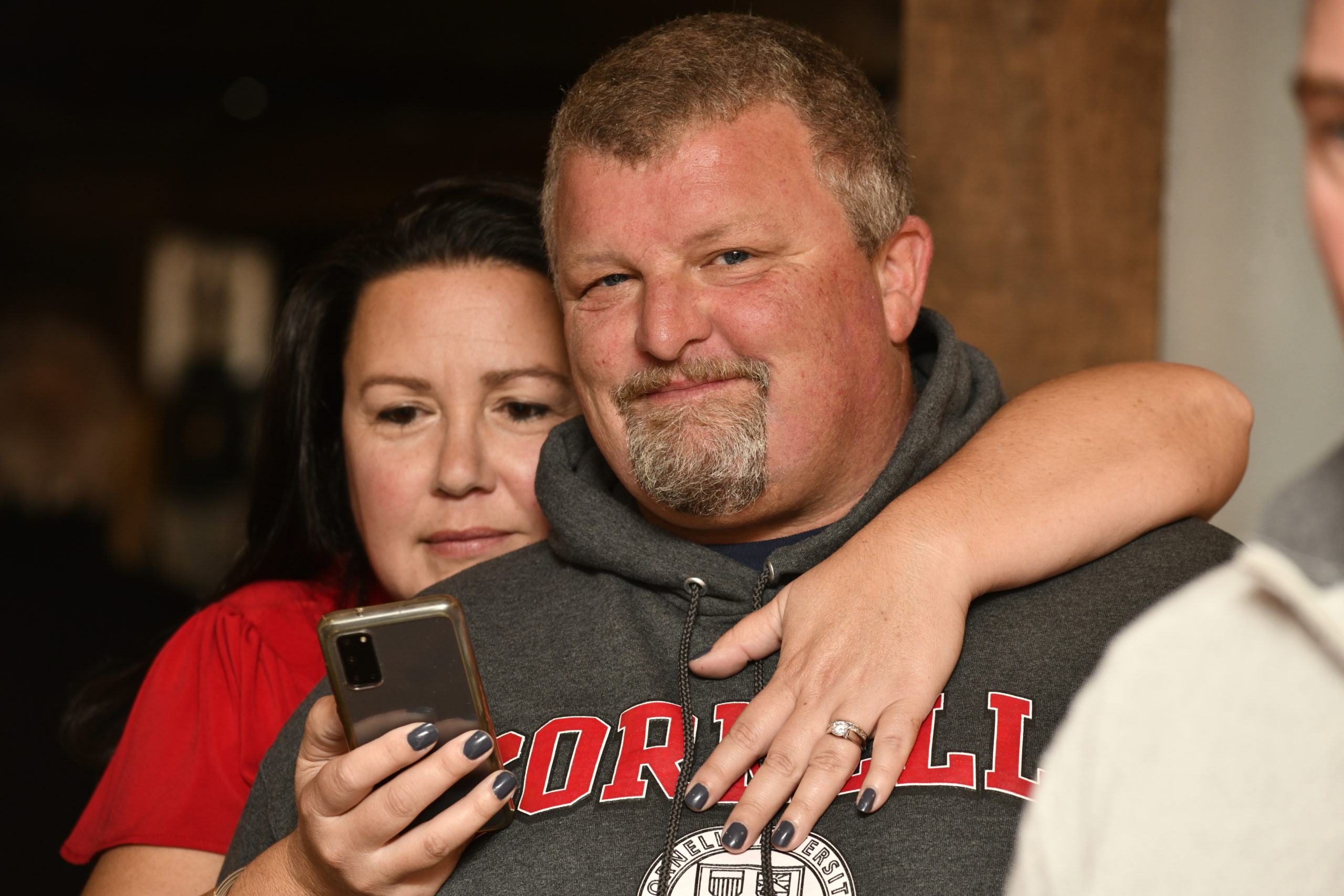 Cynthia McNamara checks election results with her husband Dan on Tuesday night at the Westhampton Beach VFW.   DANA SHAW