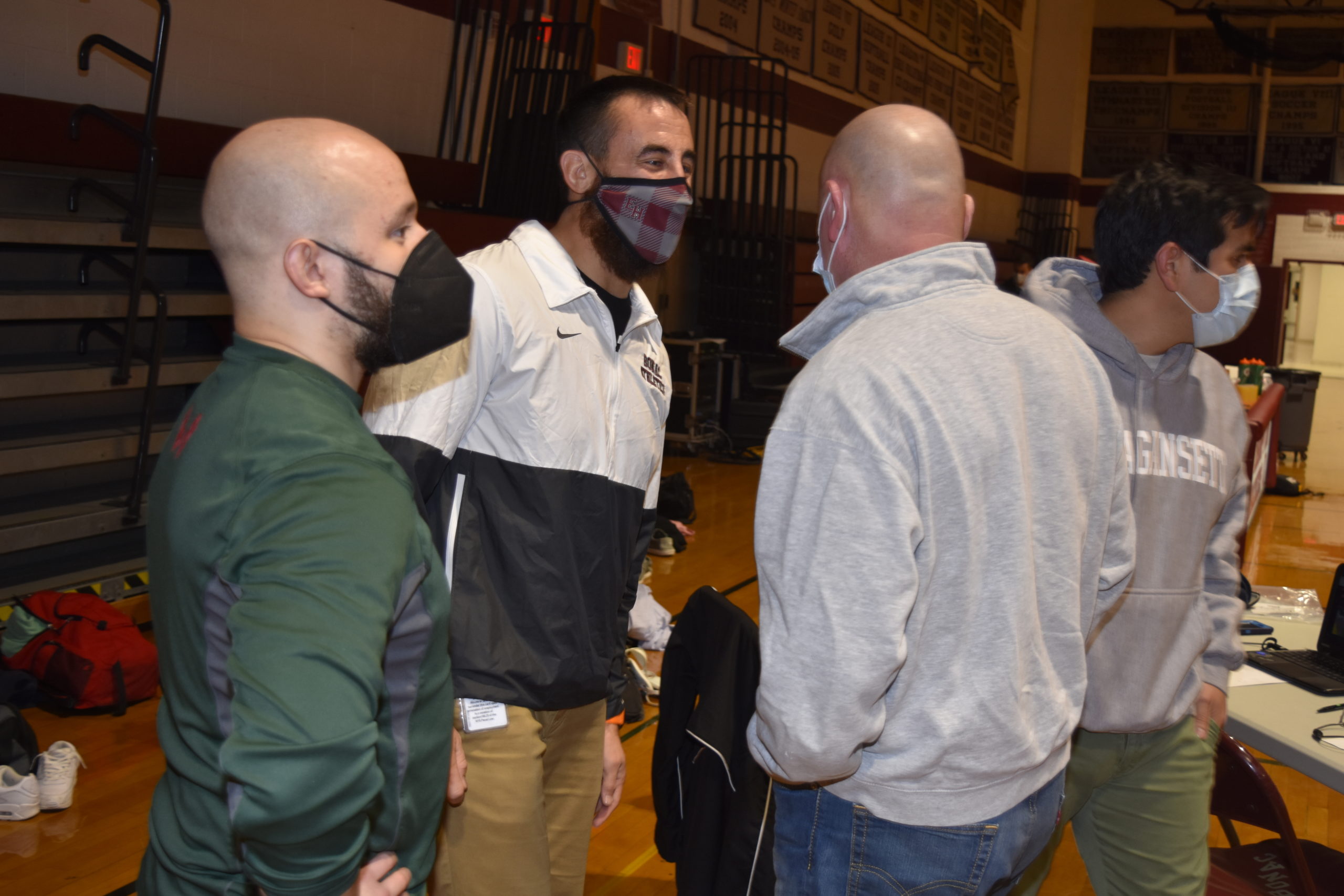 Ethan Mitchell shares a moment with former coach Paul Bass just prior to Friday's match.
