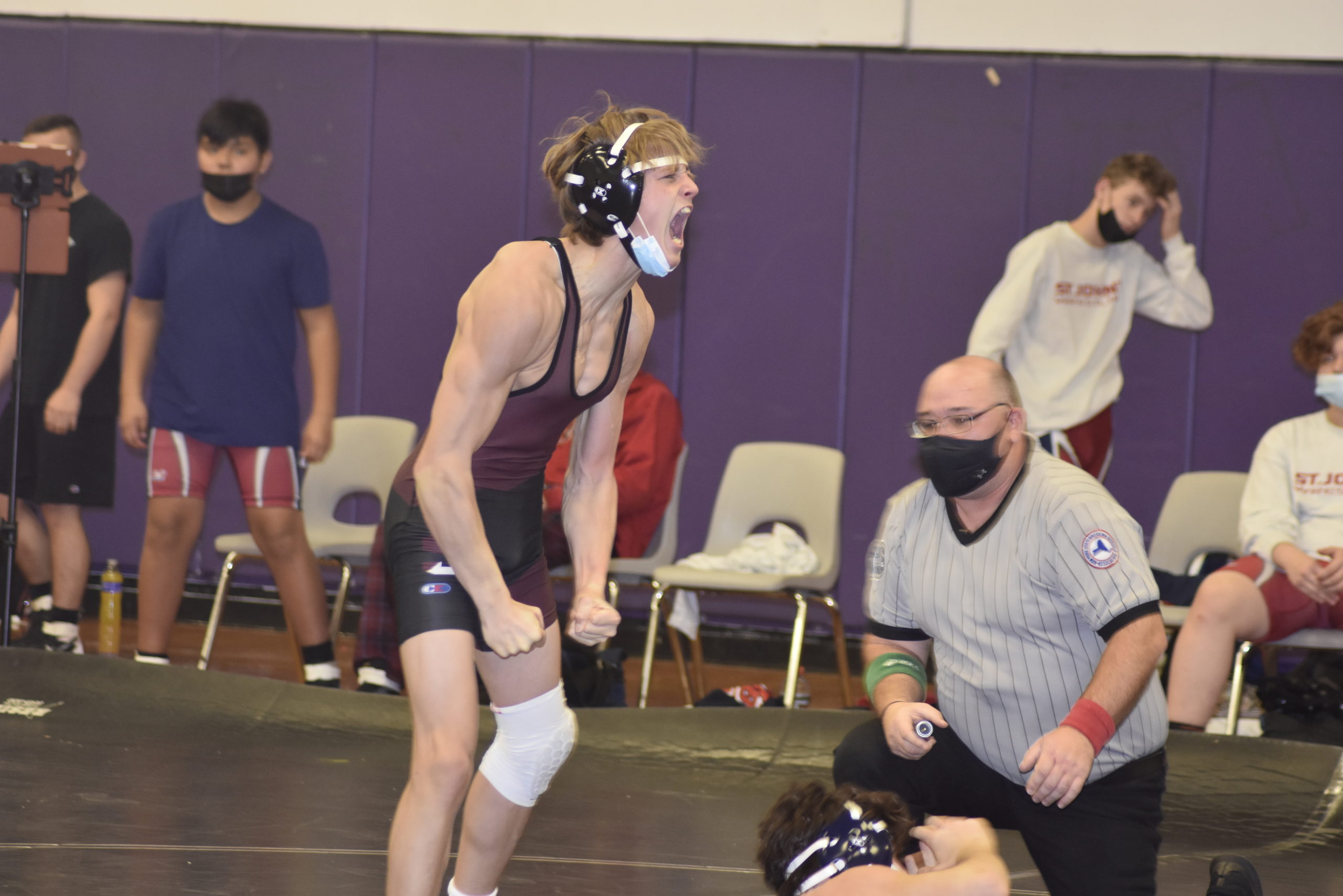 Mariner Hudson Fox is pumped up after pinning his St. John The Baptist opponent at the Doc Fallot Memorial Duals on Saturday.