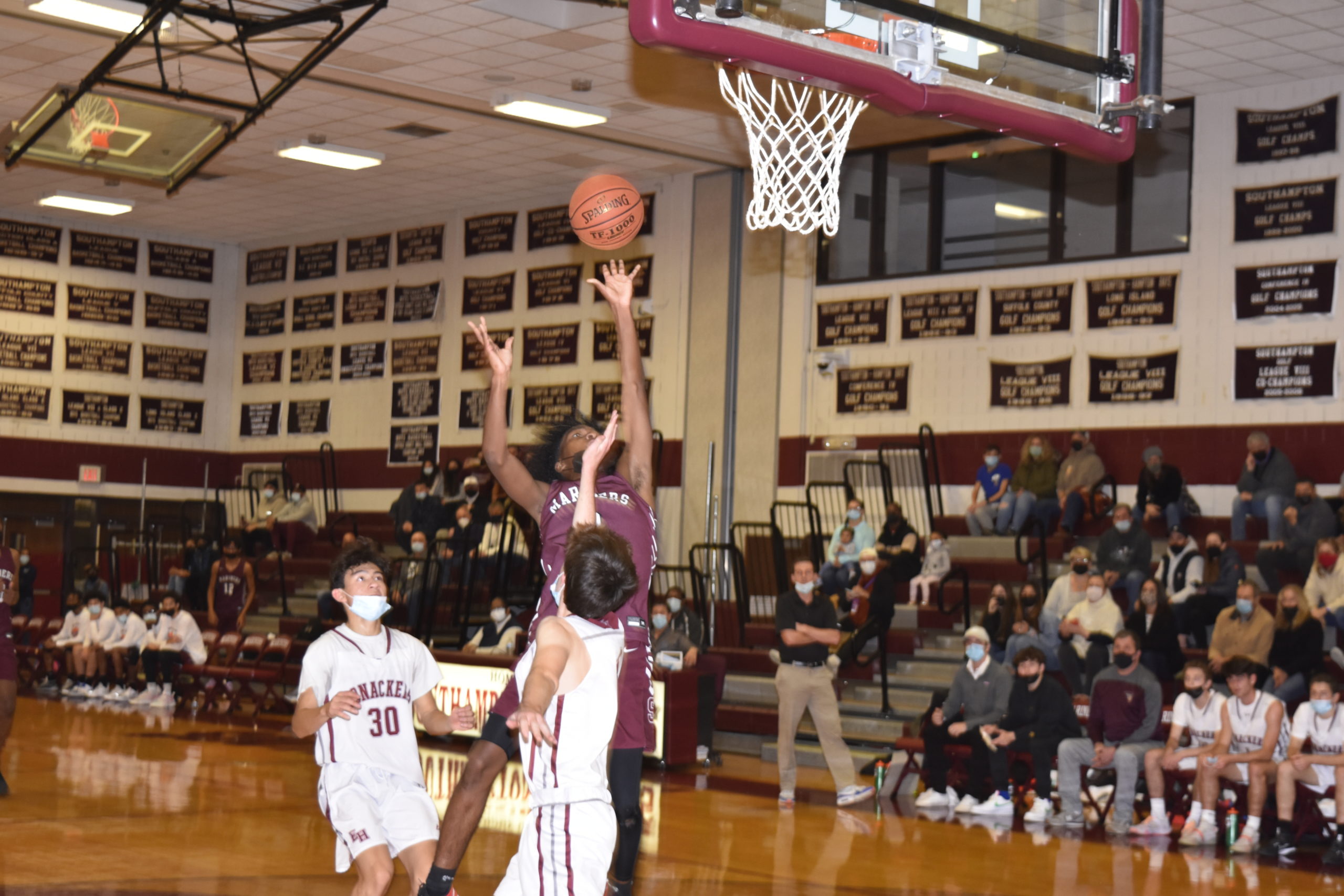 Southampton senior Derek Reed tries to avoid East Hampton sophomore Liam Fowkes.