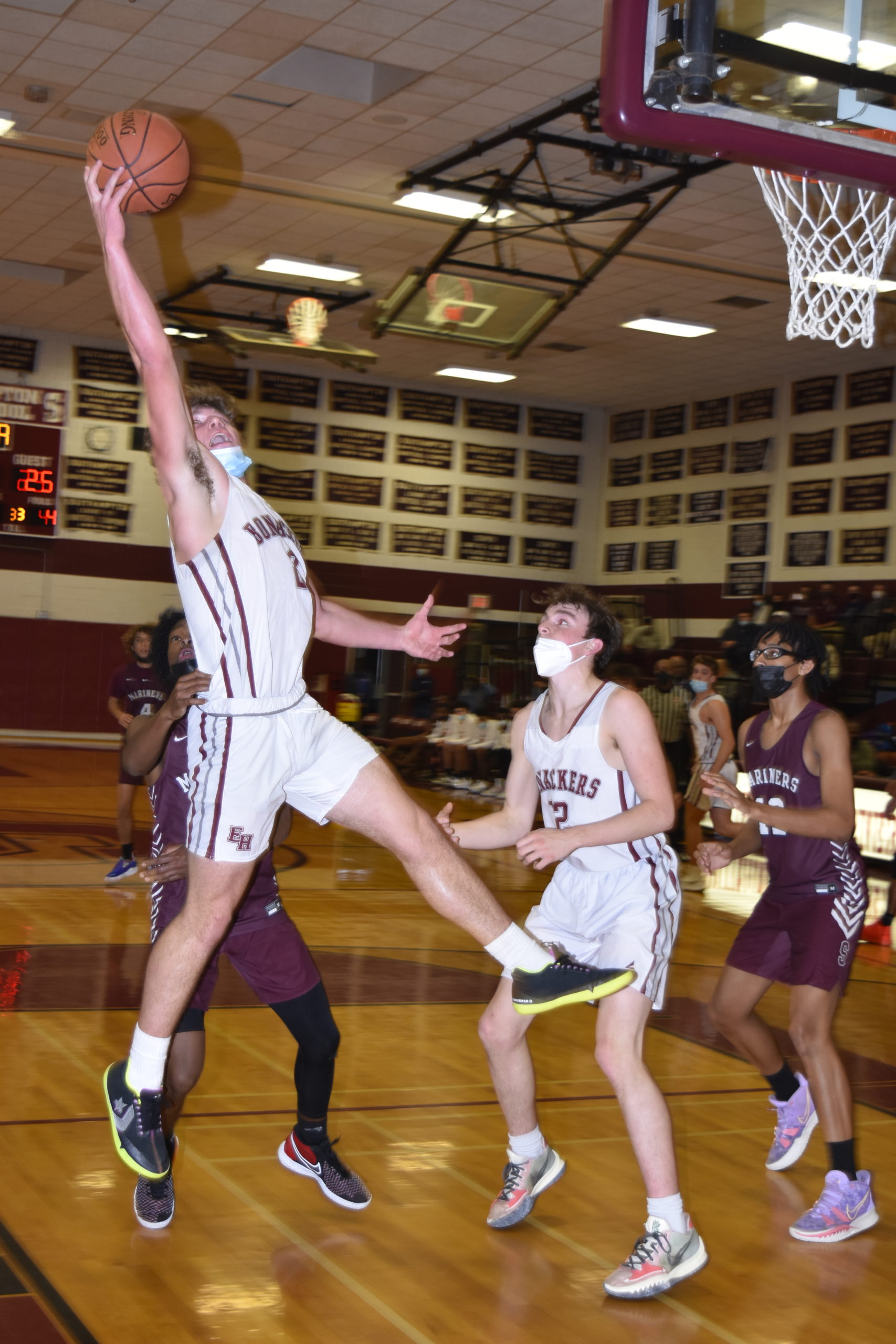 East Hampton junior Finn Byrnes grabs a rebound.