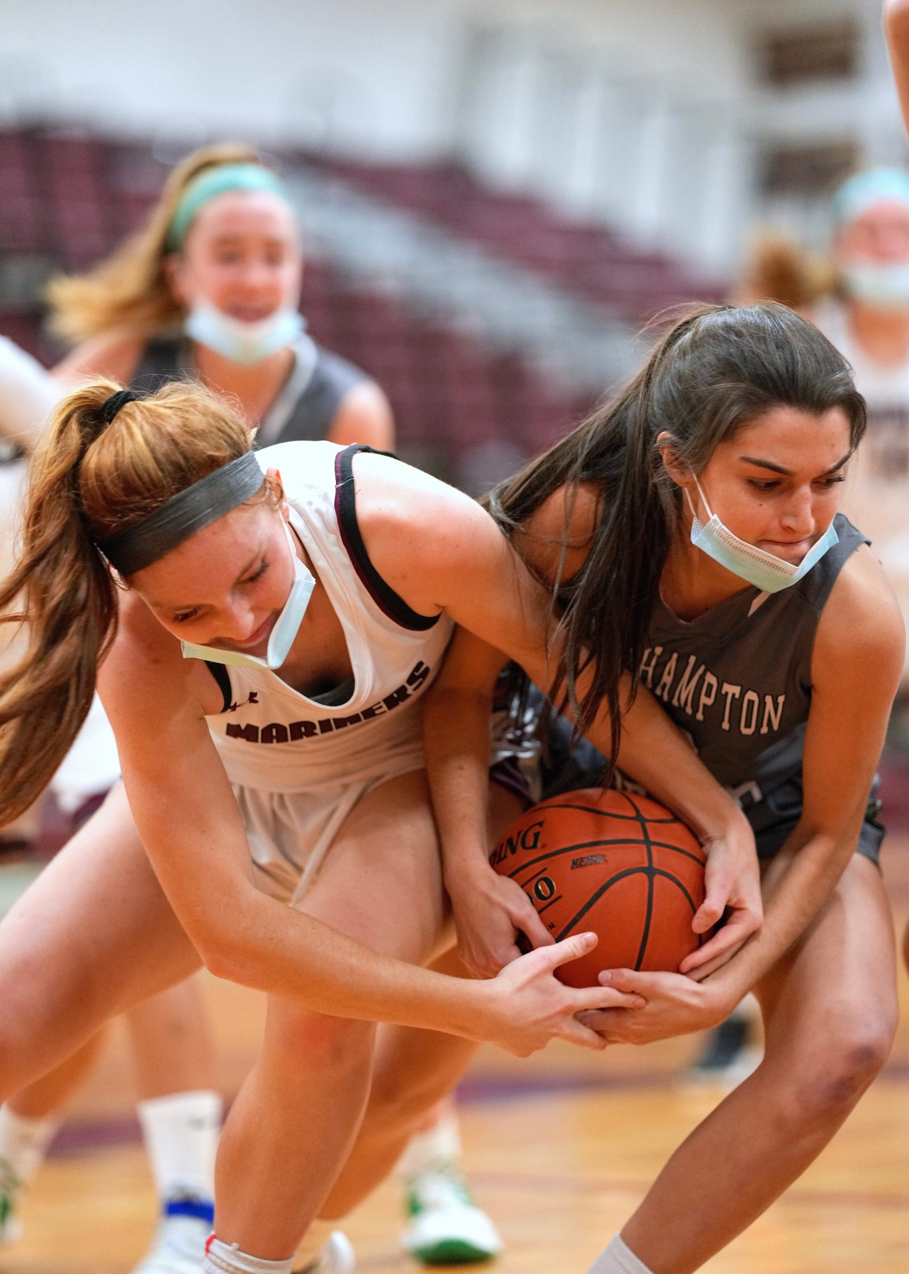 Southampton senior Carli Cameron and Westhampton Beach classmate Allie Parascandola fight for possession. RON ESPOSITO
