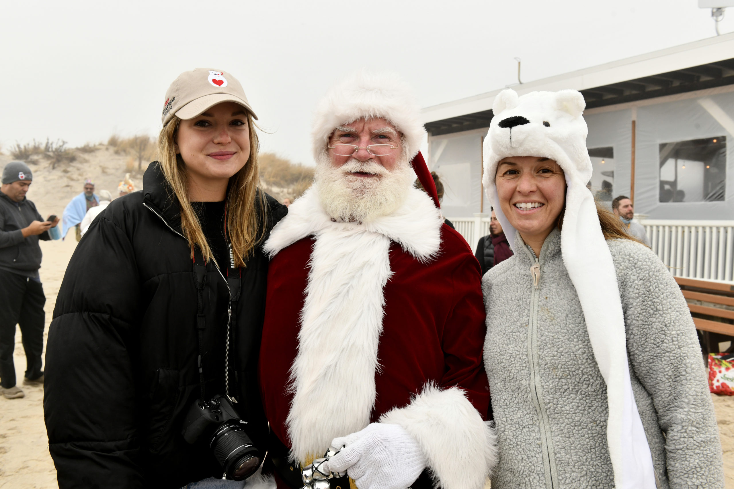 Delaney Jones and Molly Bishop of Heart of the Hamptons with Santa at the Polar Bear Plunge.  DANA SHAW