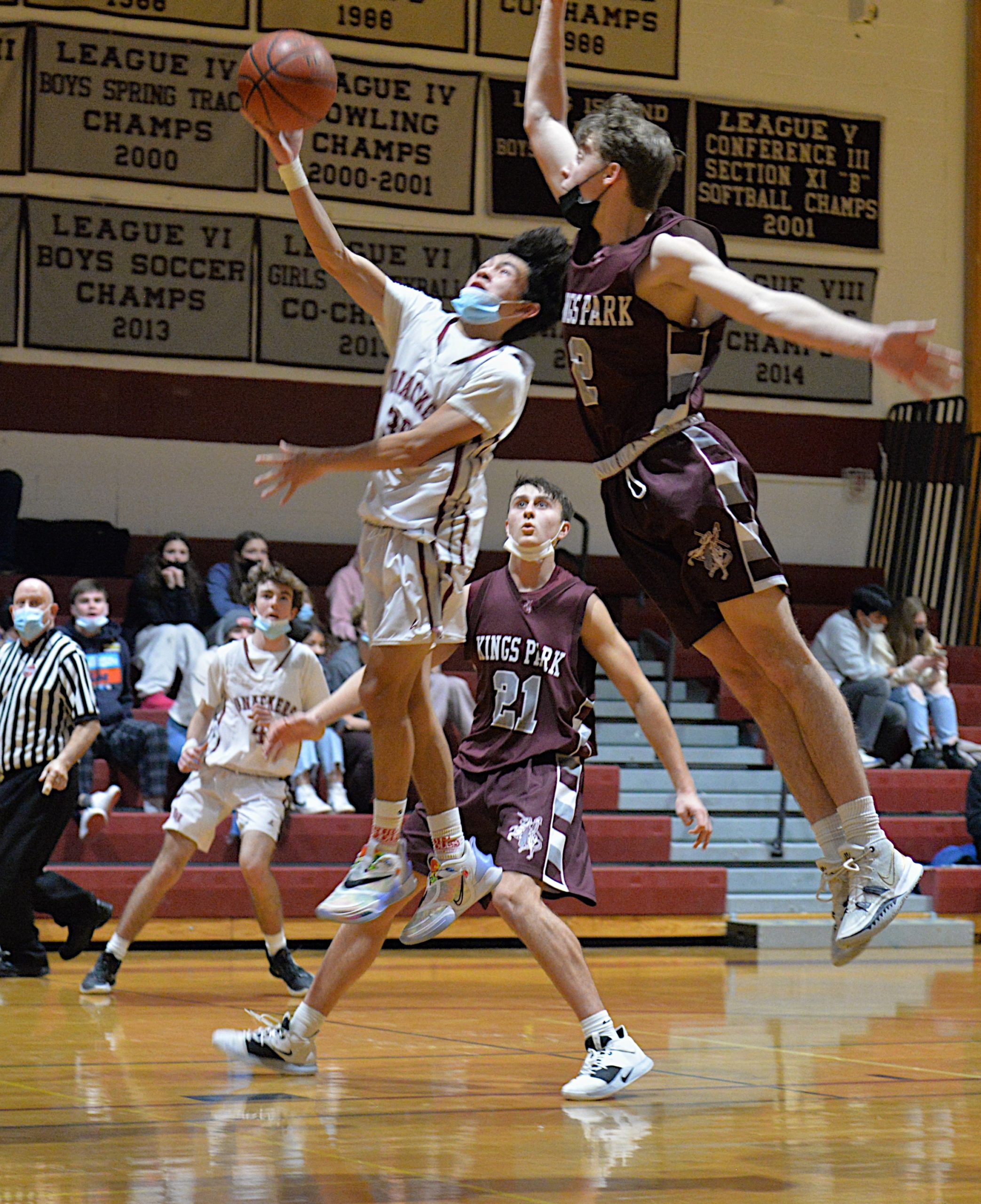 An East Hampton player tries to score on a layup.