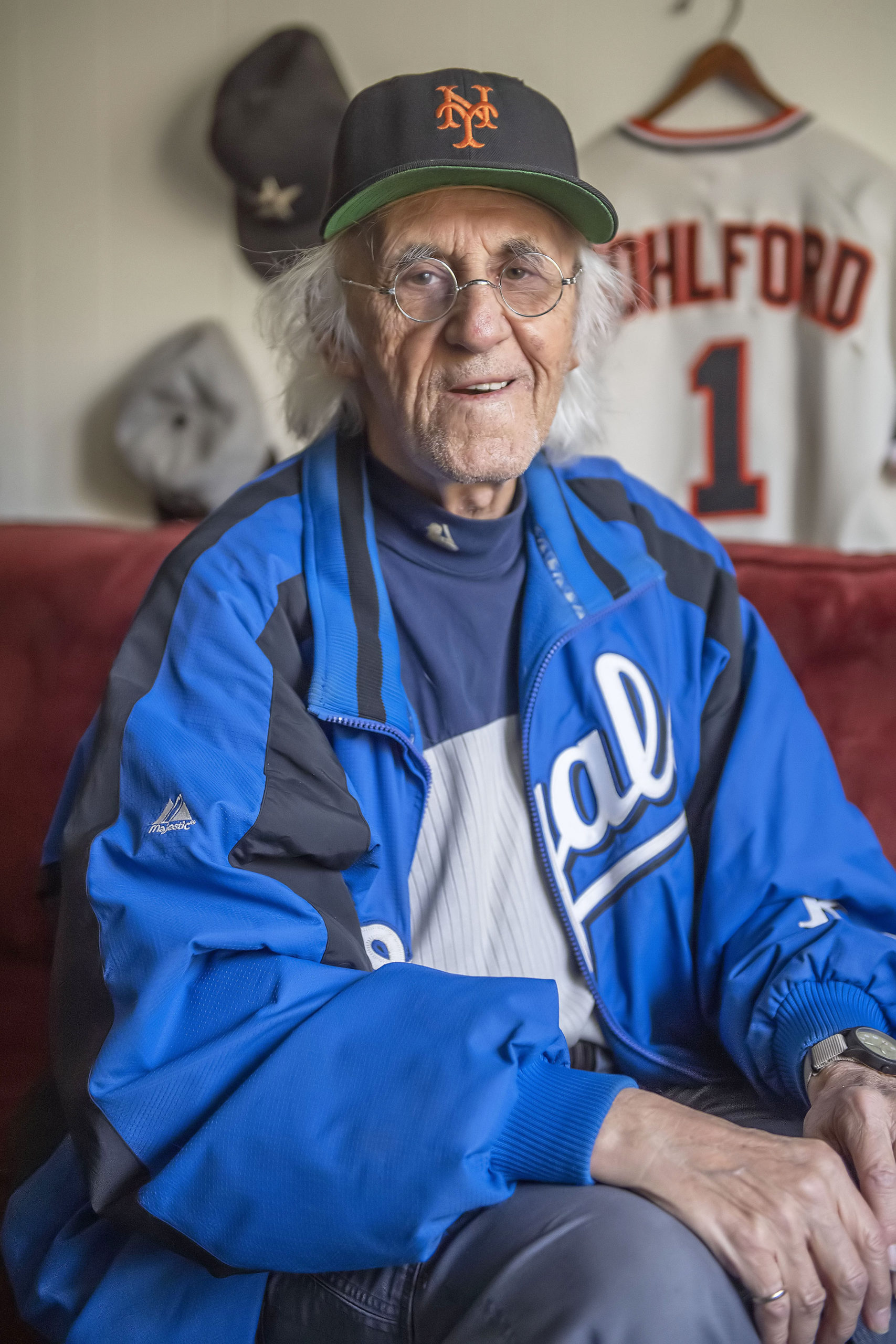 Hugh King, the East Hampton Press 2021 Person of the Year, in his baseball room at home in Amagansett.