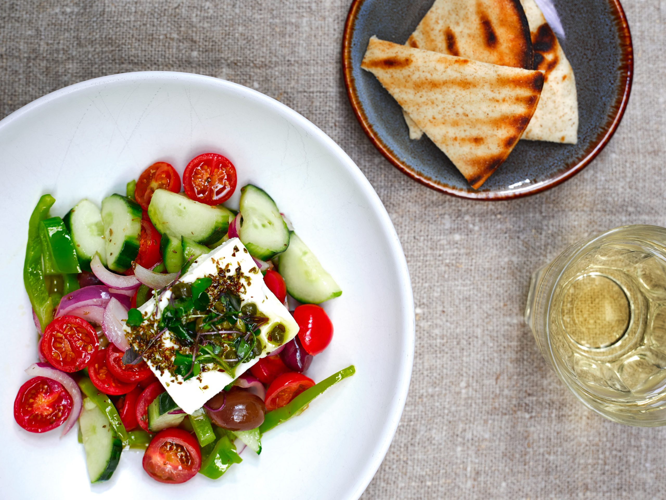 Elaia Estiatorio's Horiatiki (tomato, cucumber, pepper, red oinions, feta, capes and kalamata olives) with pita.