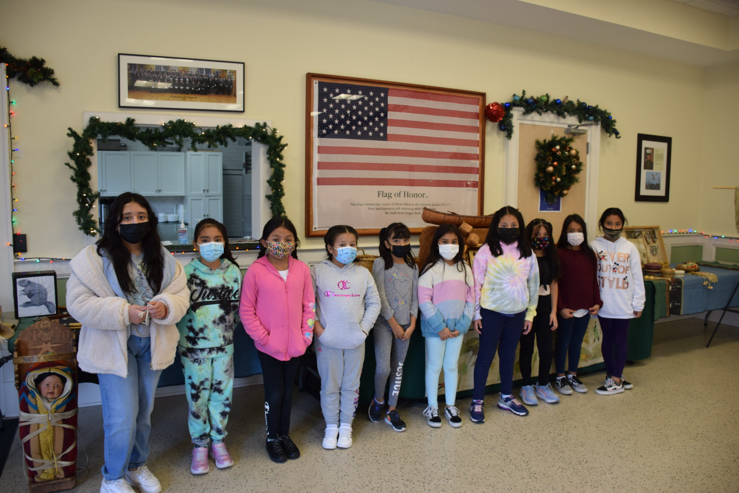 Hampton Bays Elementary School fourth graders learned more about the lives and history of Native Americans during a presentation by Journeys into American Indian Territory on December 16 at the Hampton Bays Fire firehouse. Through the interactive workshop, students explored a Native American museum featuring artifacts such as clothing, dolls, pottery and a longhouse replica. They also listened to traditional Native American stories, played Native American games and
constructed clay pots.