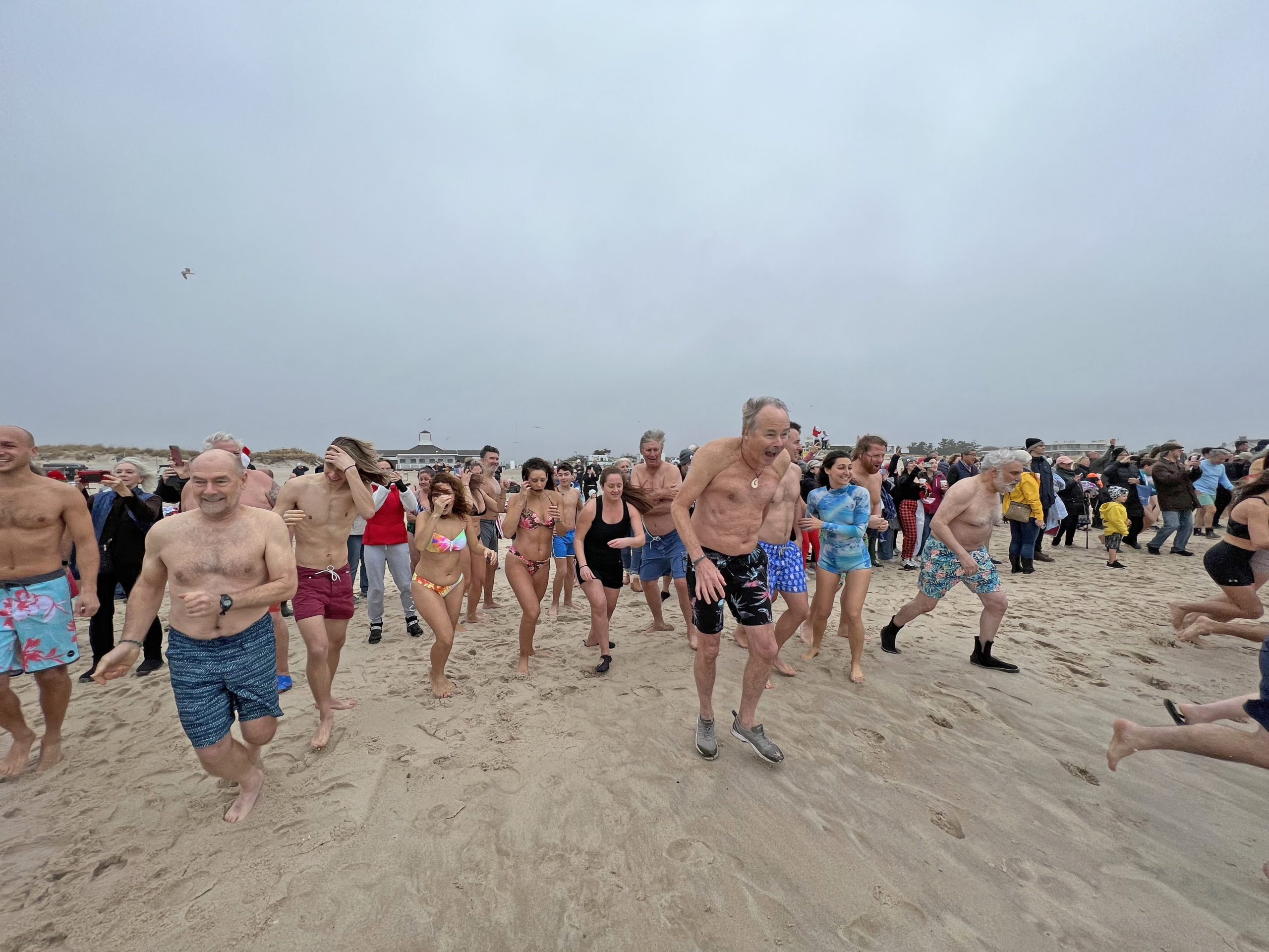 Participants of the 2021 Polar Bear Plunge brave rough conditions on Saturday morning.  DANA SHAW