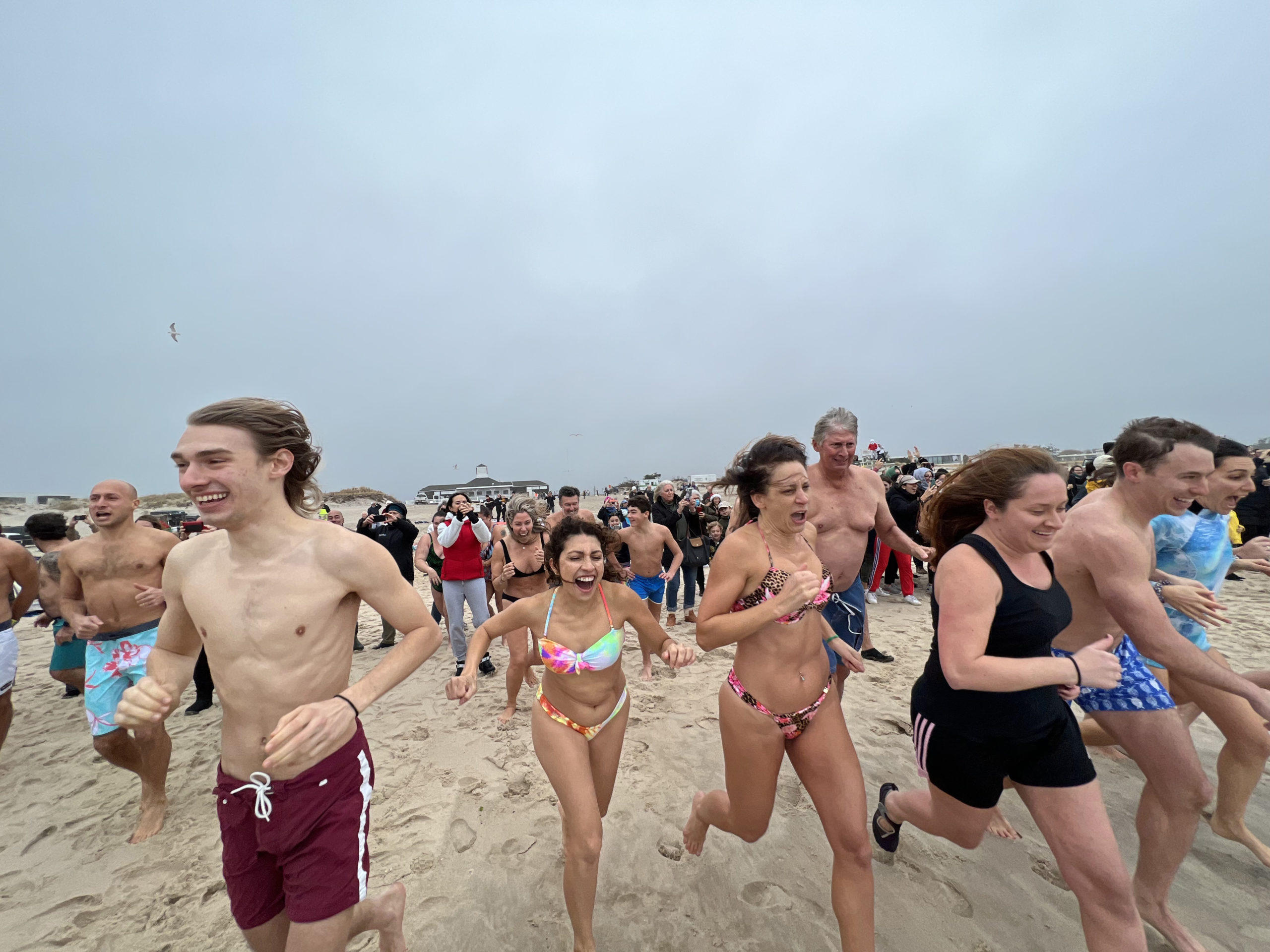 Participants of the 2021 Polar Bear Plunge brave rough conditions on Saturday morning.  DANA SHAW