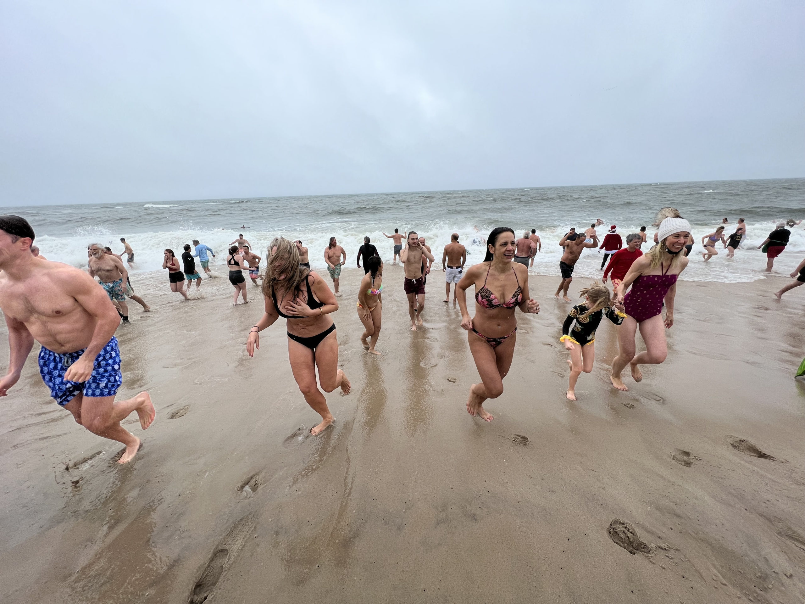 Participants of the 2021 Polar Bear Plunge brave rough conditions on Saturday morning.  DANA SHAW