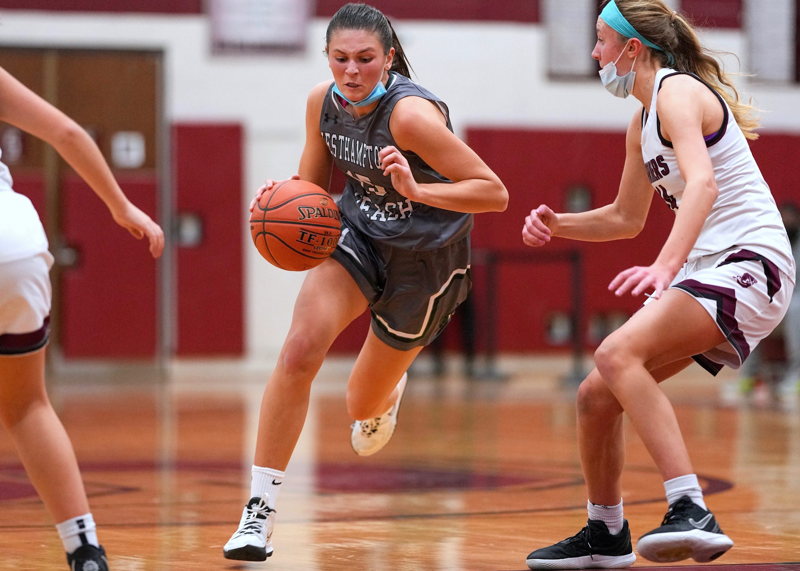 Westhampton Beach senior Olivia Rongo carries the ball across the court. RON ESPOSITO