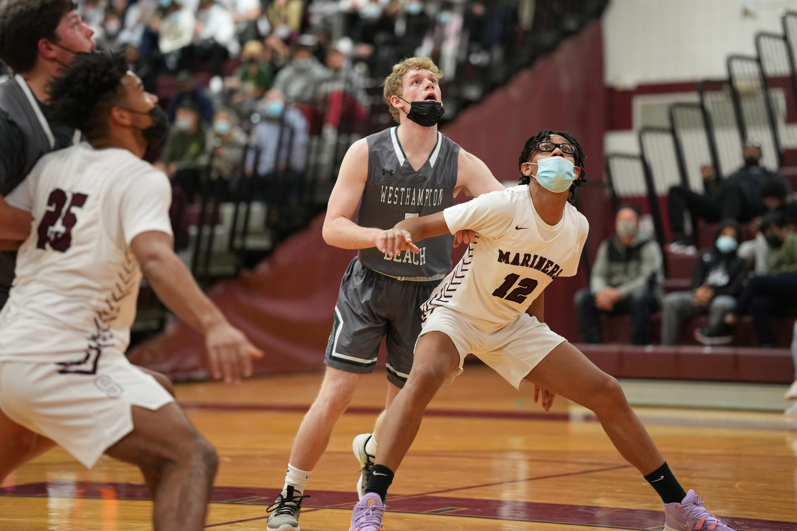 Southampton senior Ryan Smith boxes out Westhampton Beach senior Nick Waszkelewicz for one of his 17 rebounds in the game.