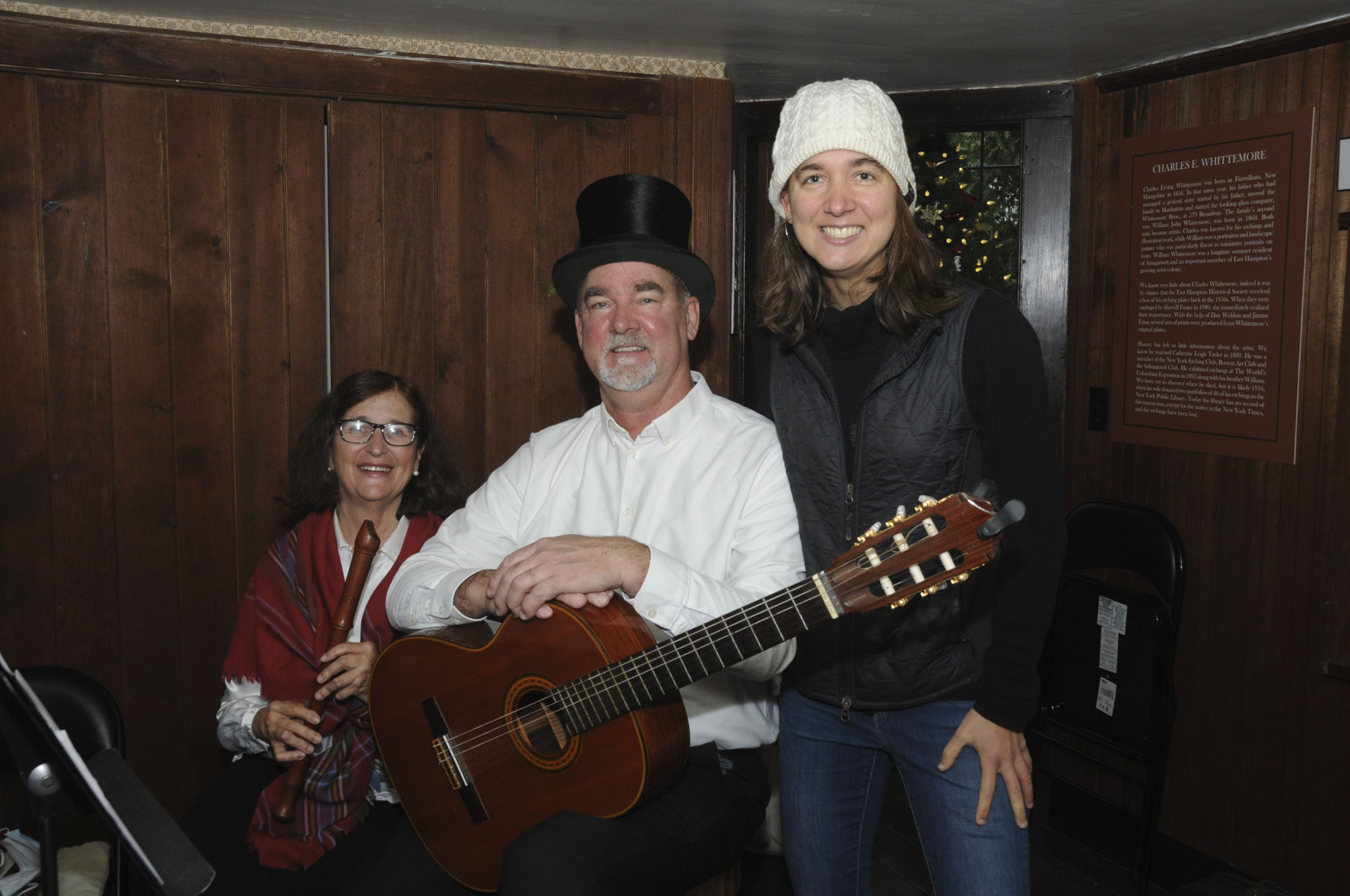Marilyn's and Peter Van Scoyoc with their daughter Amy at a special musical performance  on Saturday as  part of Victorian Christmas at the Moran Studio.  From the balcony of the historic Moran studio, Peter and Marilyn Van Scoyoc performed an instrumental duet of traditional holiday music, similar to what might have been performed at a festive turn-of-the-century Moran holiday party.  Presented by the East Hampton Historical Society, experience the merriment, sights and sounds of a 19th century Victorian Christmas – on display through December 23rd! easthamptonhistory.org   RICHARD LEWIN