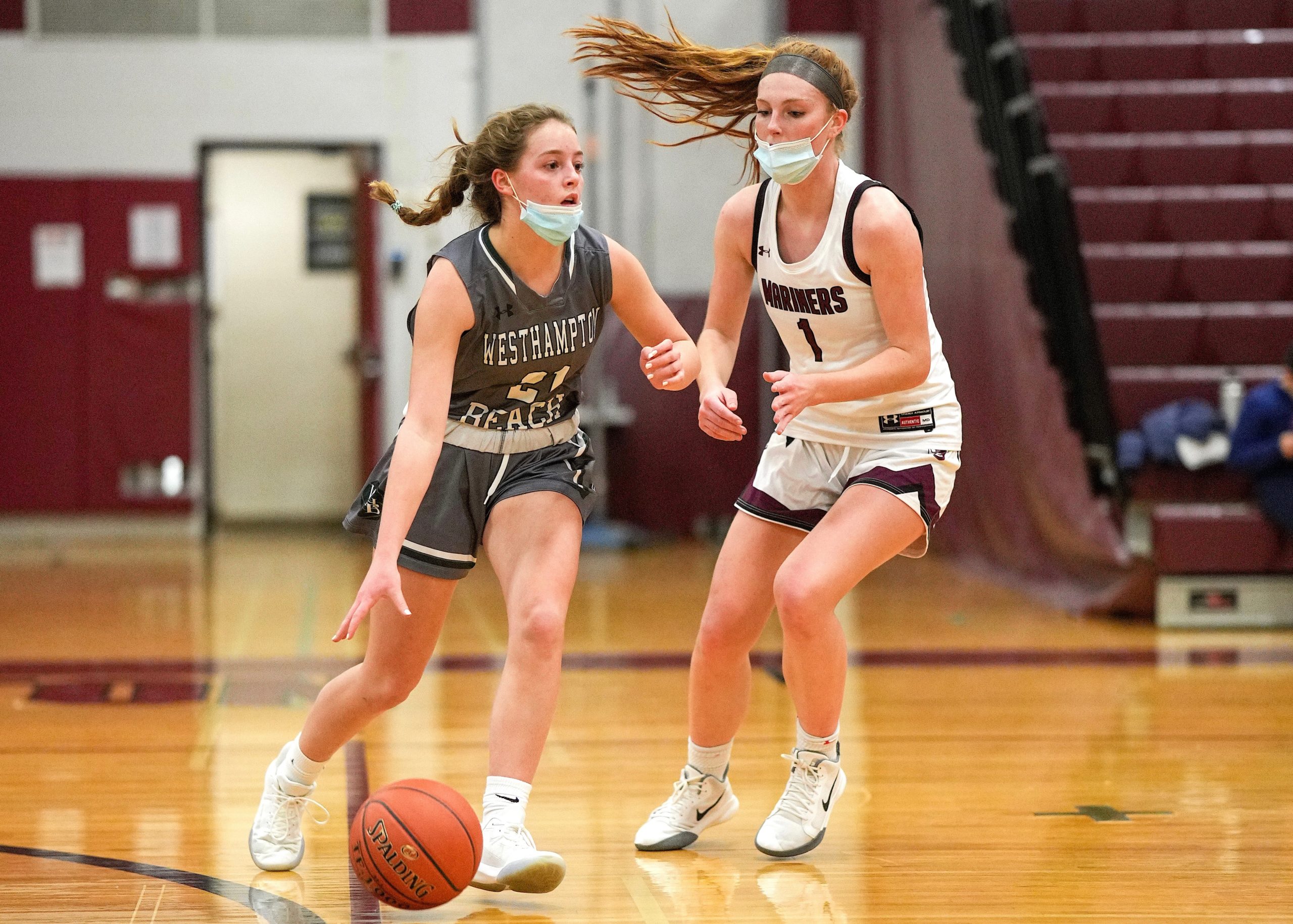 Westhampton Beach sophomore guard Haley Waszkelewicz gets the ball past Southampton senior Carli Cameron. RON ESPOSITO