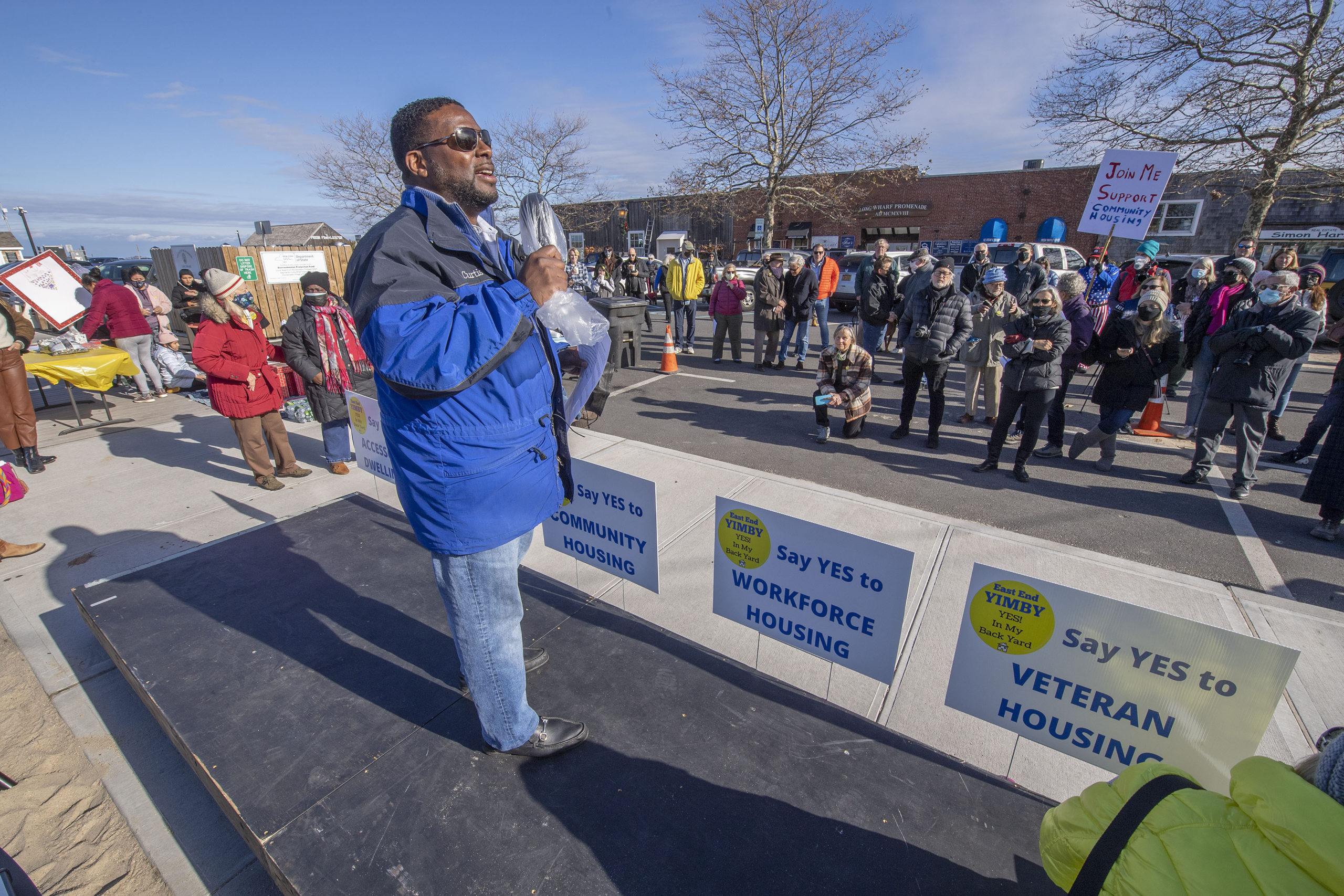 Southampton Housing Authority Executive Director Curtis Highsmith speaks at the East End YIMBY Rally for Affordable Housing, at the windmill on Long Wharf in Sag Harbor on Saturday.   MICHAEL HELLER
