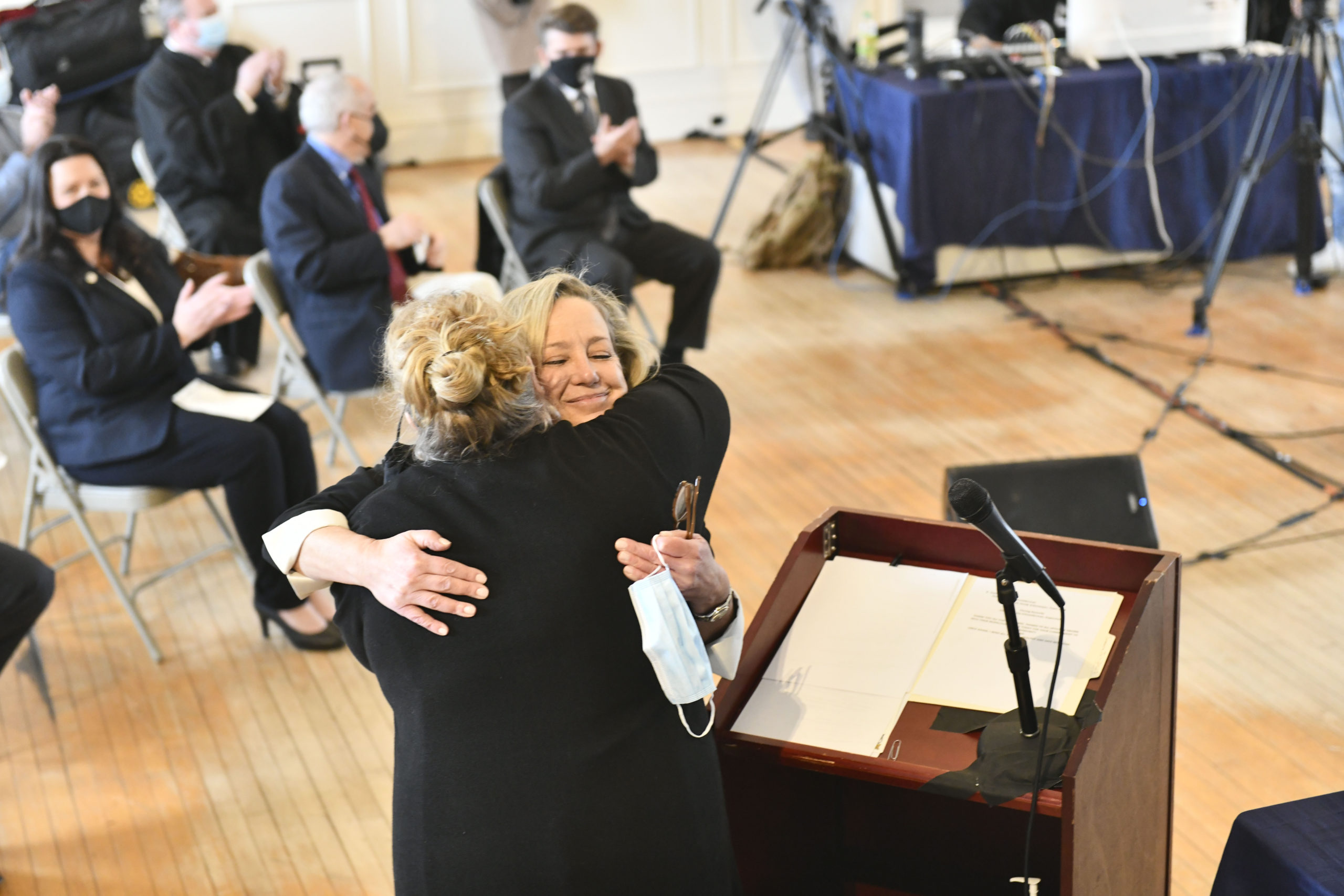 Southampton Town Clerk Sundy Schermeyer hugs Deputy Town Clerk Kimberly Ottati after being sworn in on Wednesday.