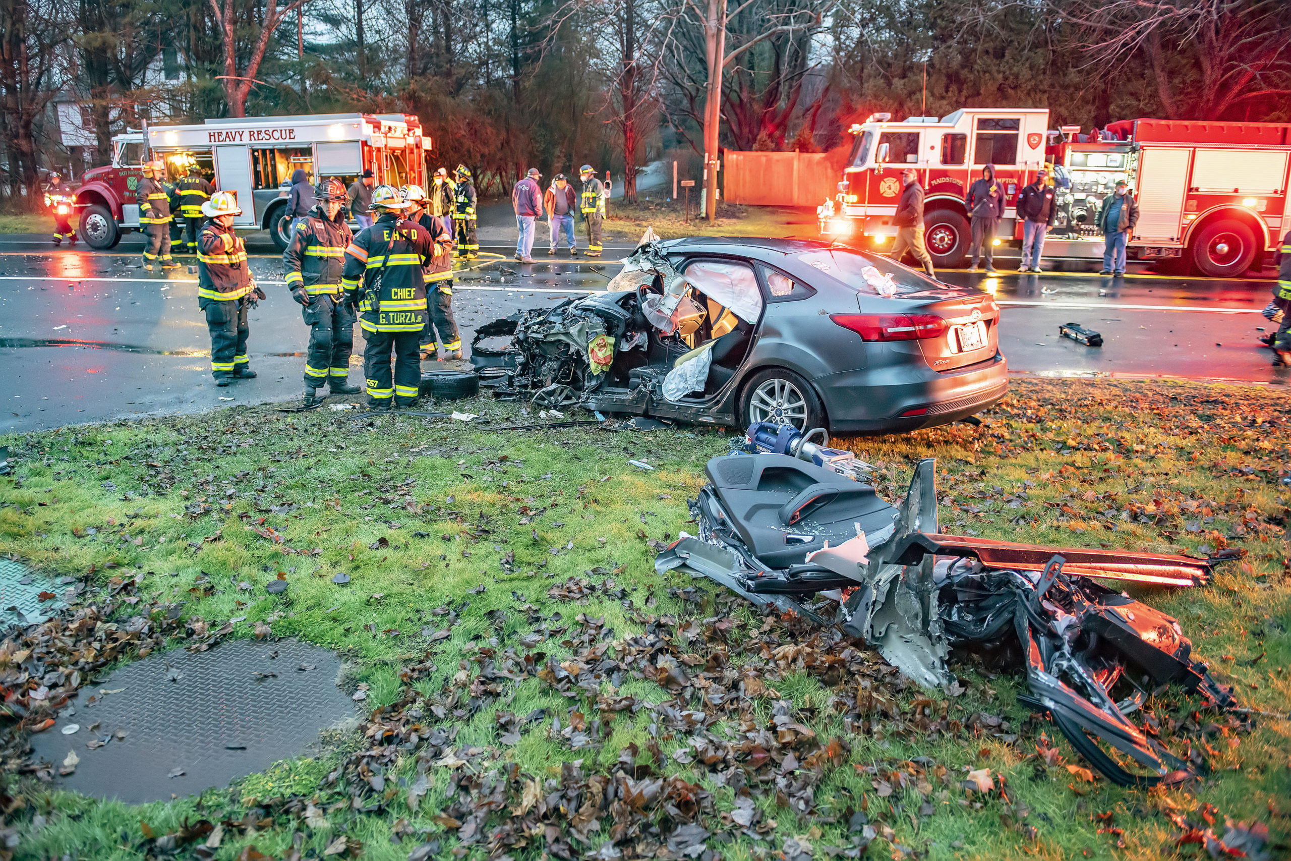 Members of the East Hampton Fire Department's Heavy Rescue Squad worked to extricate one of the drivers of a two-vehicle car accident on Pantigo Road at Fredericka Lane on Sunday morning.  MICHAEL HELLER