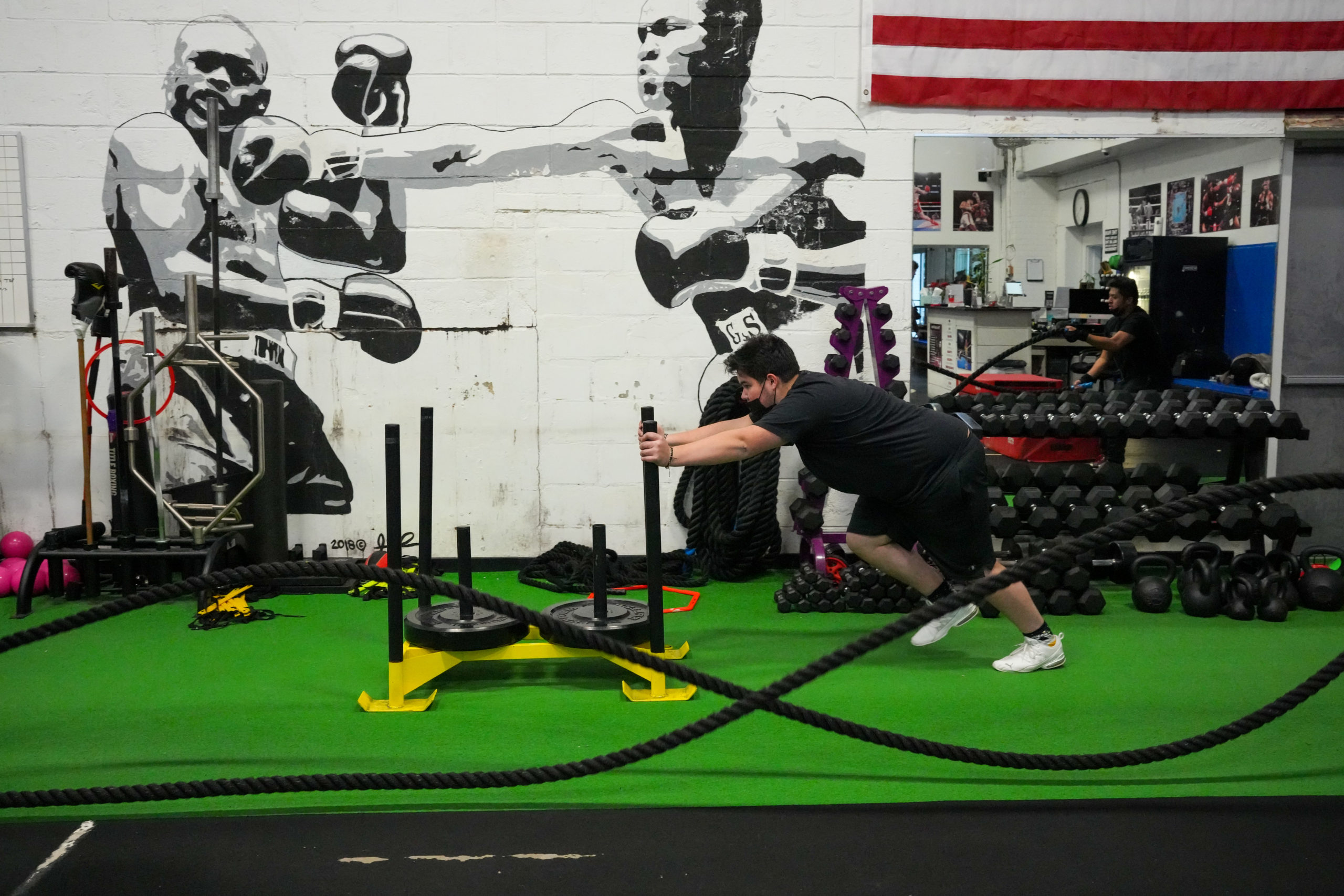 Hampton Bays student Juan Fernández pushes a sled. RON ESPOSITO