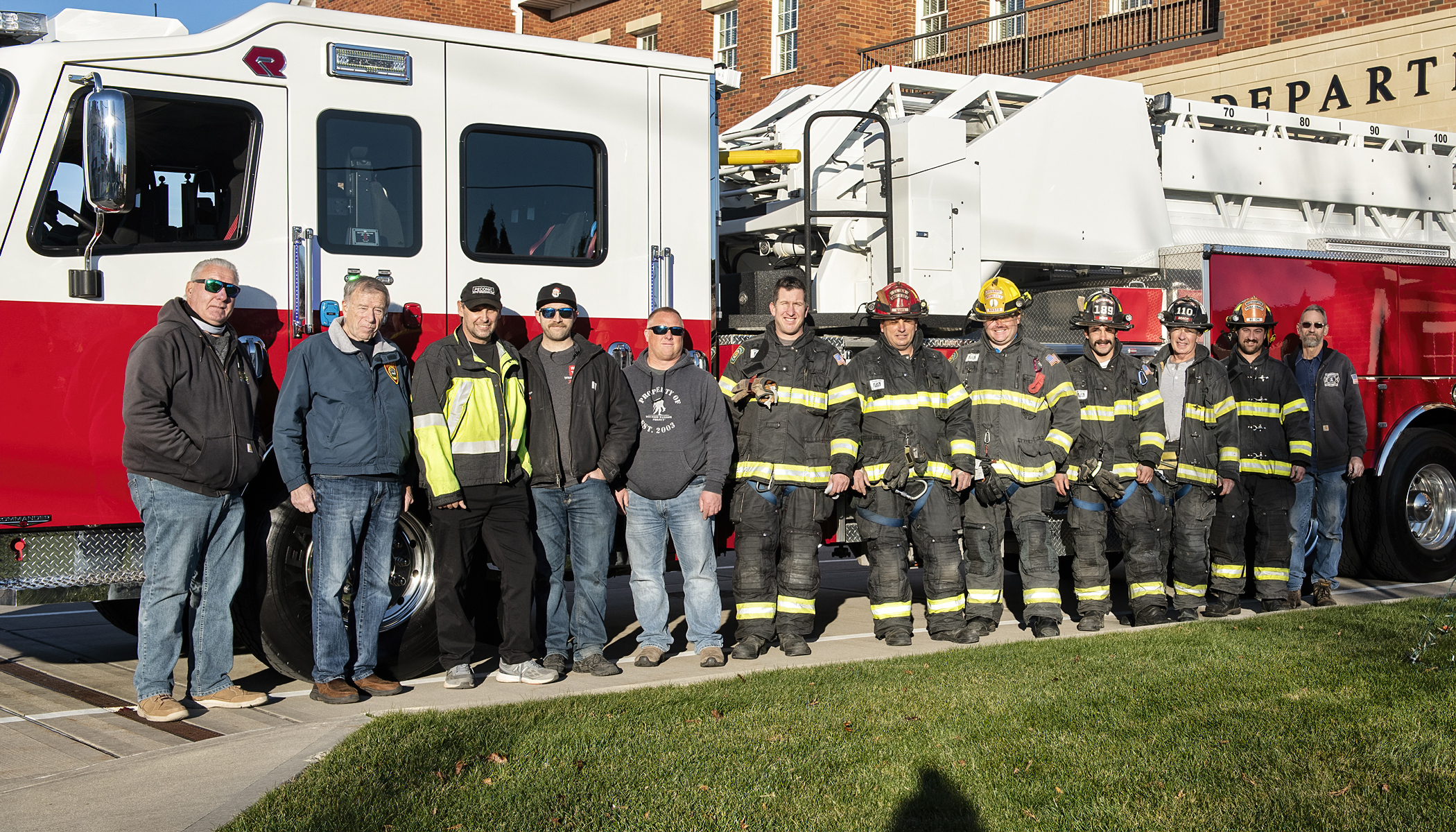 Brian Durr and Anthony Granito of Gabrielli Truck Sales, from the left, delivered the Westhampton Beach Fire Department’s new Rosenbauer tower ladder on Monday, December 20. A number of firefighters were on hand to welcome the new addition to the department as was the department’s mechanic, Mark Northrup, far left. The new apparatus will be put into service as soon as lettering and logos can be applied and the members can be trained on it. COURTESY WESTHAMPTON BEACH FIRE DEPARTMENT