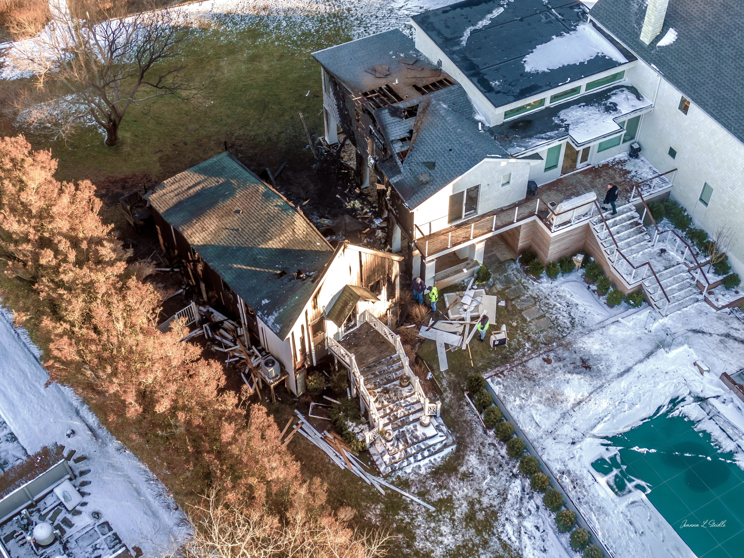 Saturday's fire started in the smaller of the two residences on the property at 106 Little Neck Road but was spread to the other by northerly winds.