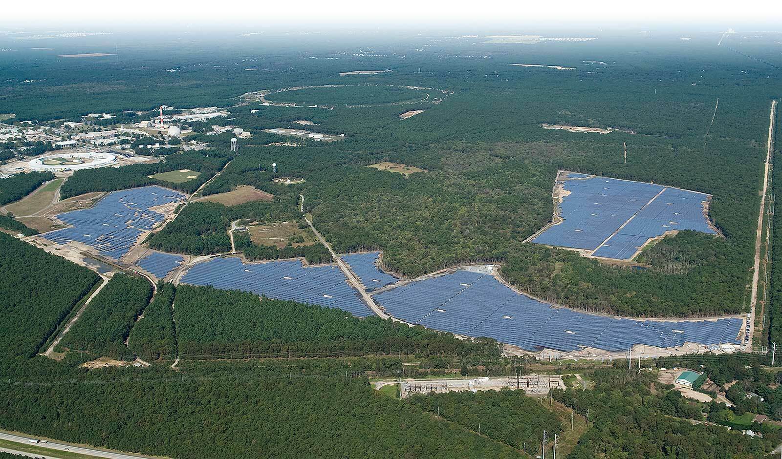 The Long Island Solar Farm generates enough energy to power 4,500 homes. Renewables such as this are now the worlds cheapest ways to generate power. BROOKHAVEN NATIONAL LAB