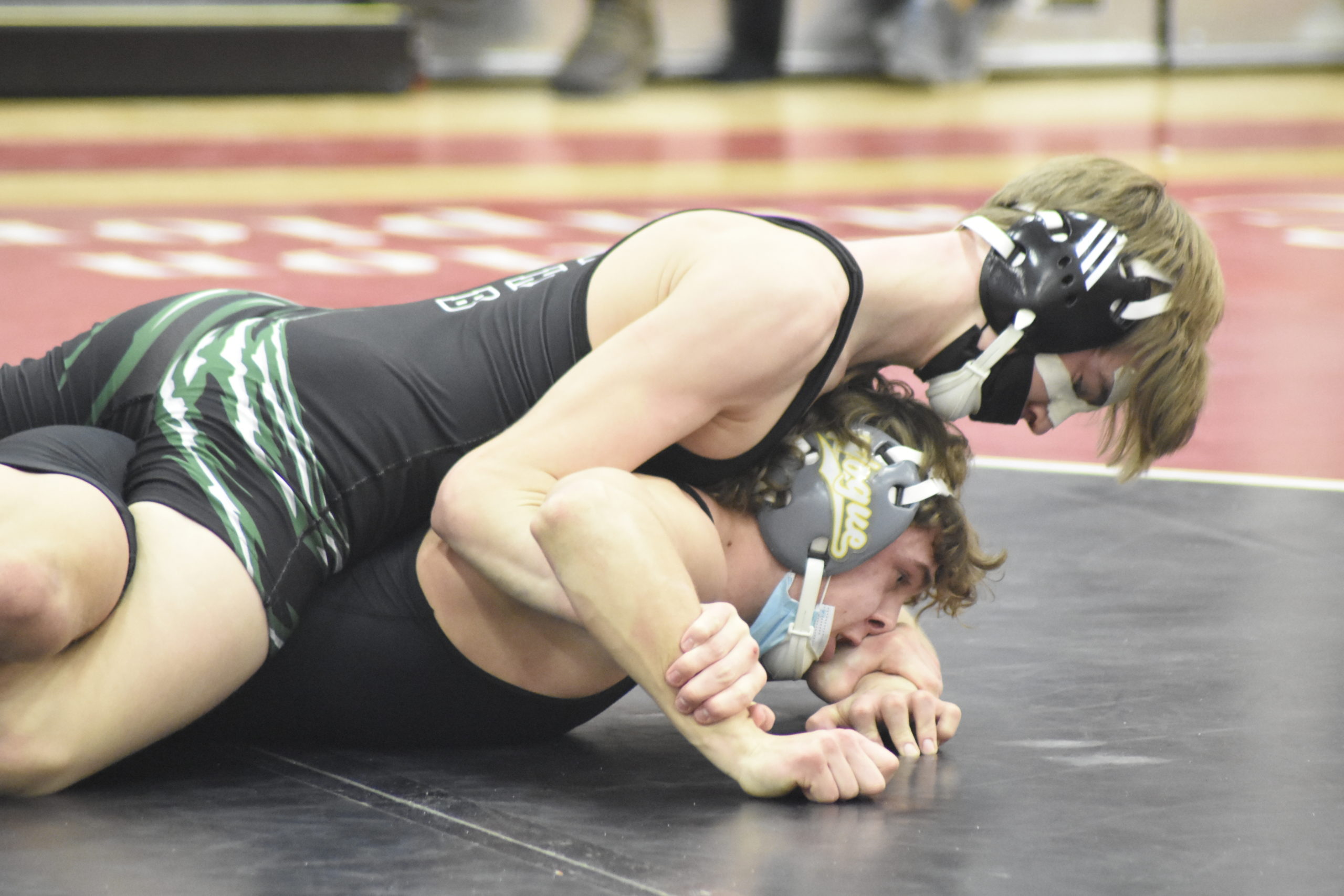 Connor Gormley of Westhampton Beach works on top of Comsewogue's Kevin Radmann.