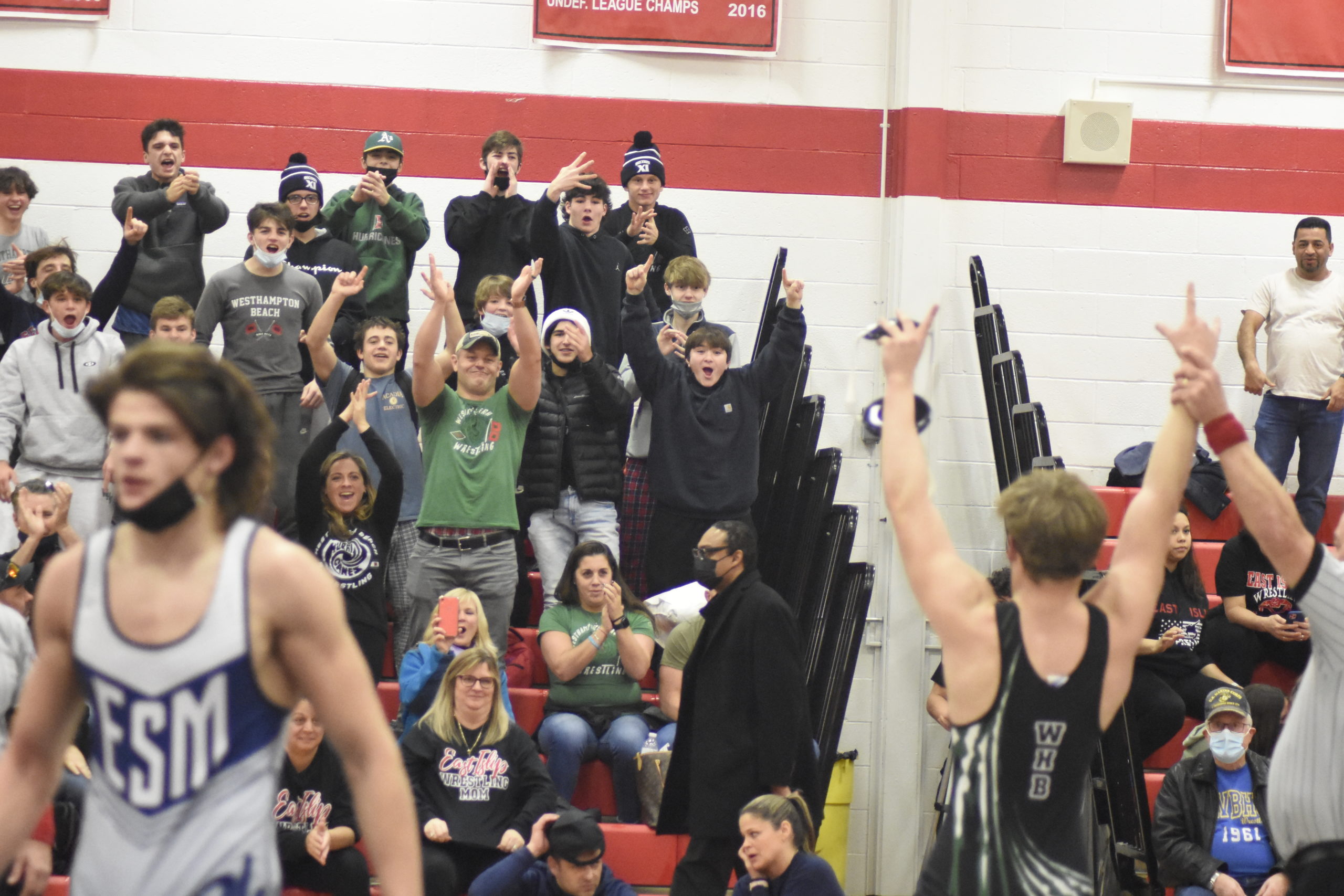 The Westhampton Beach crowd is pumped up after Dom Jurgel won the league title at 172 pounds.