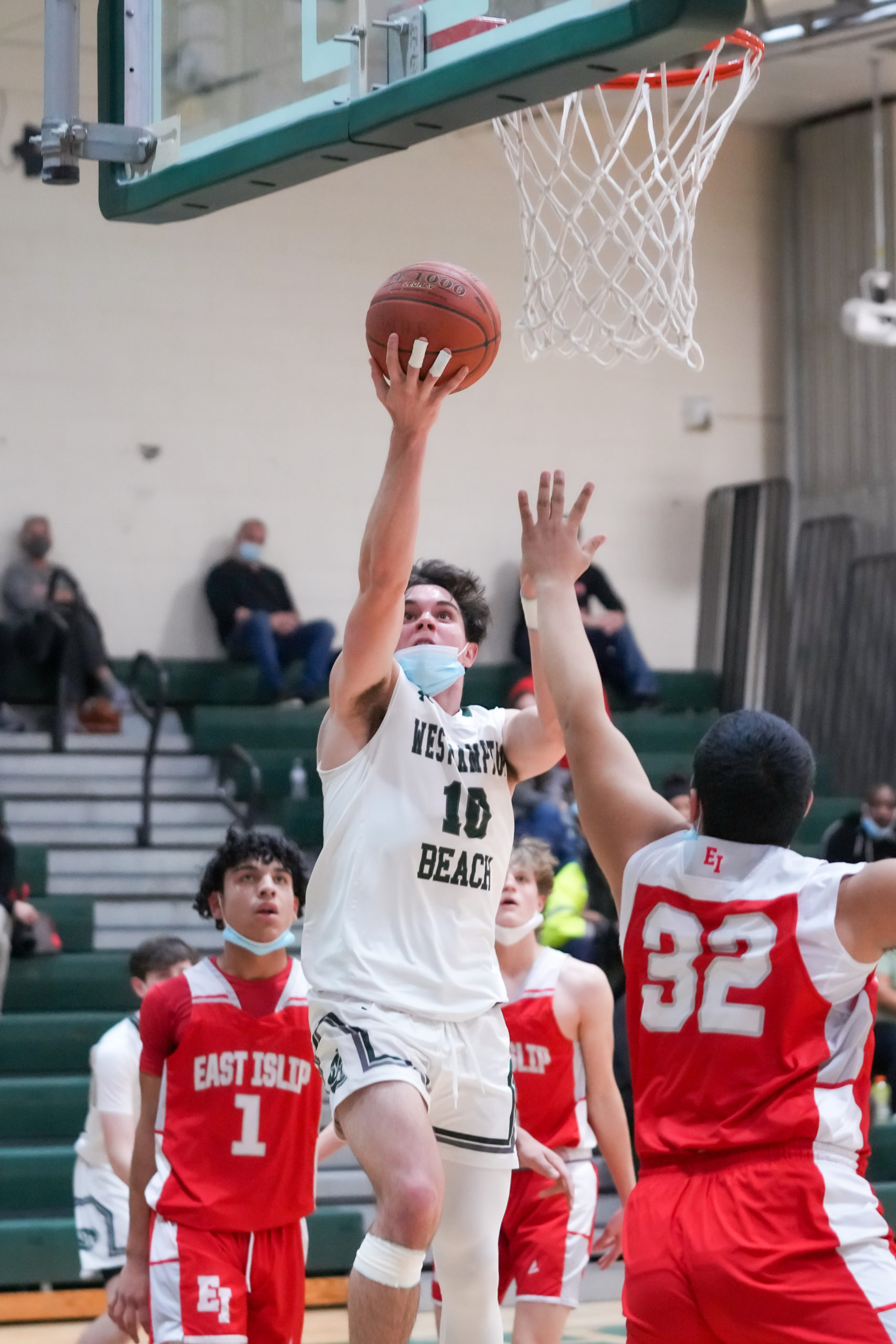 Senior guard Christian Killoran shoots and scores two of his team-high 15 points. RON ESPOSITO