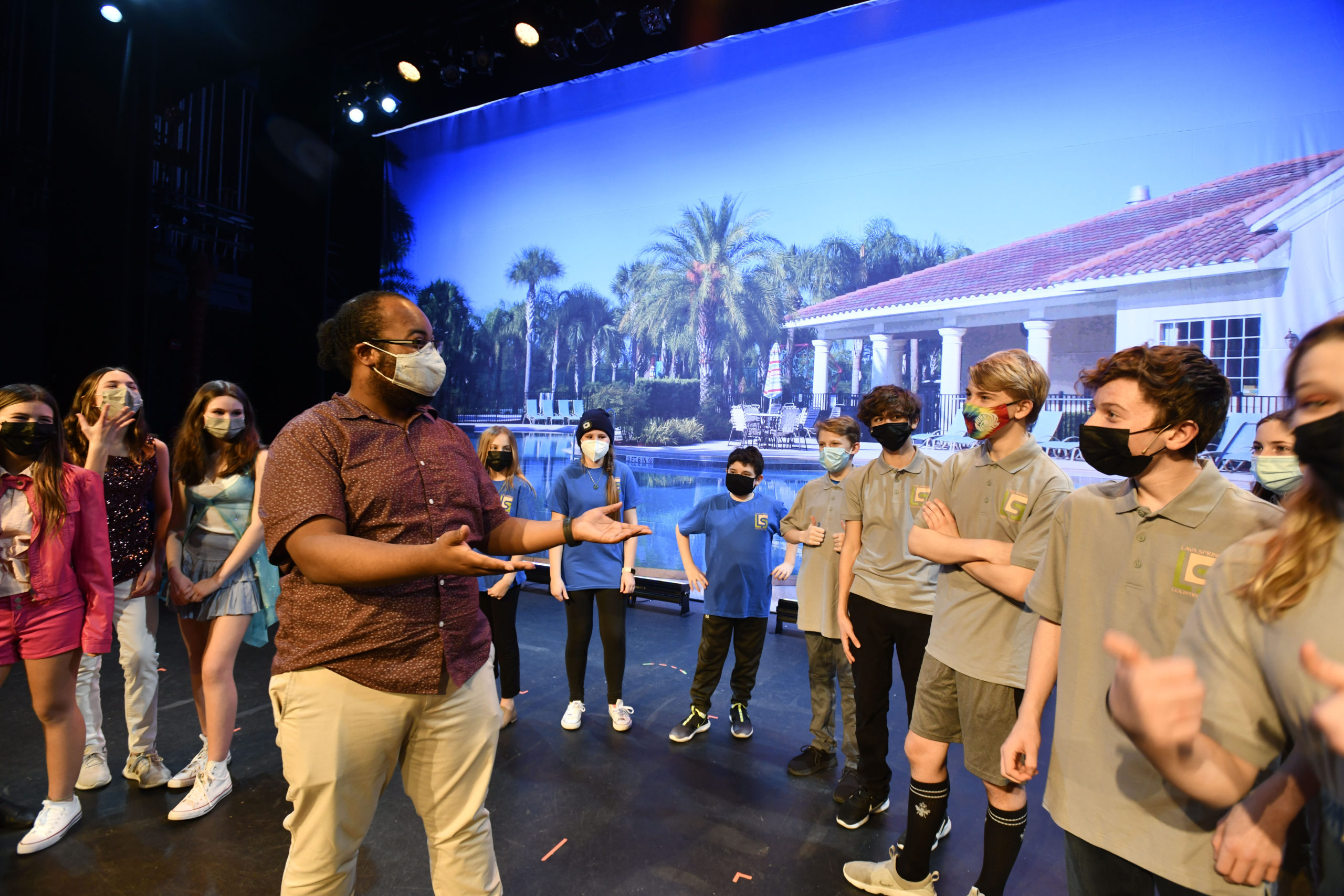 Justin Harris works with students at the Westhampton Beach Performing Arts Center for the production of “High School Musical 2.