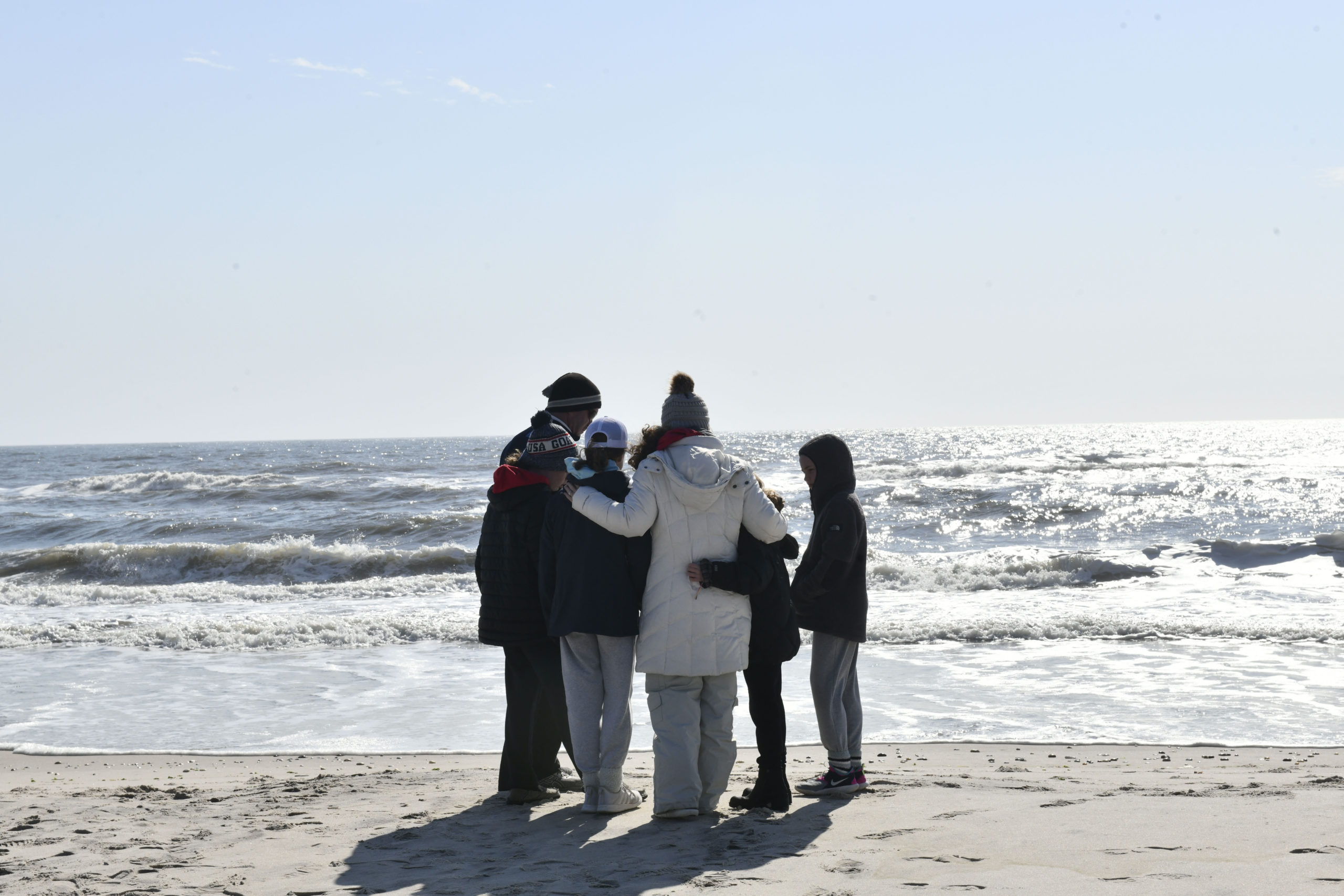 Fellow lifeguards and friends gathered at Ponquogue Beach on Saturday to the mourn the loss of Ciara McKeon.  DANA SHAW