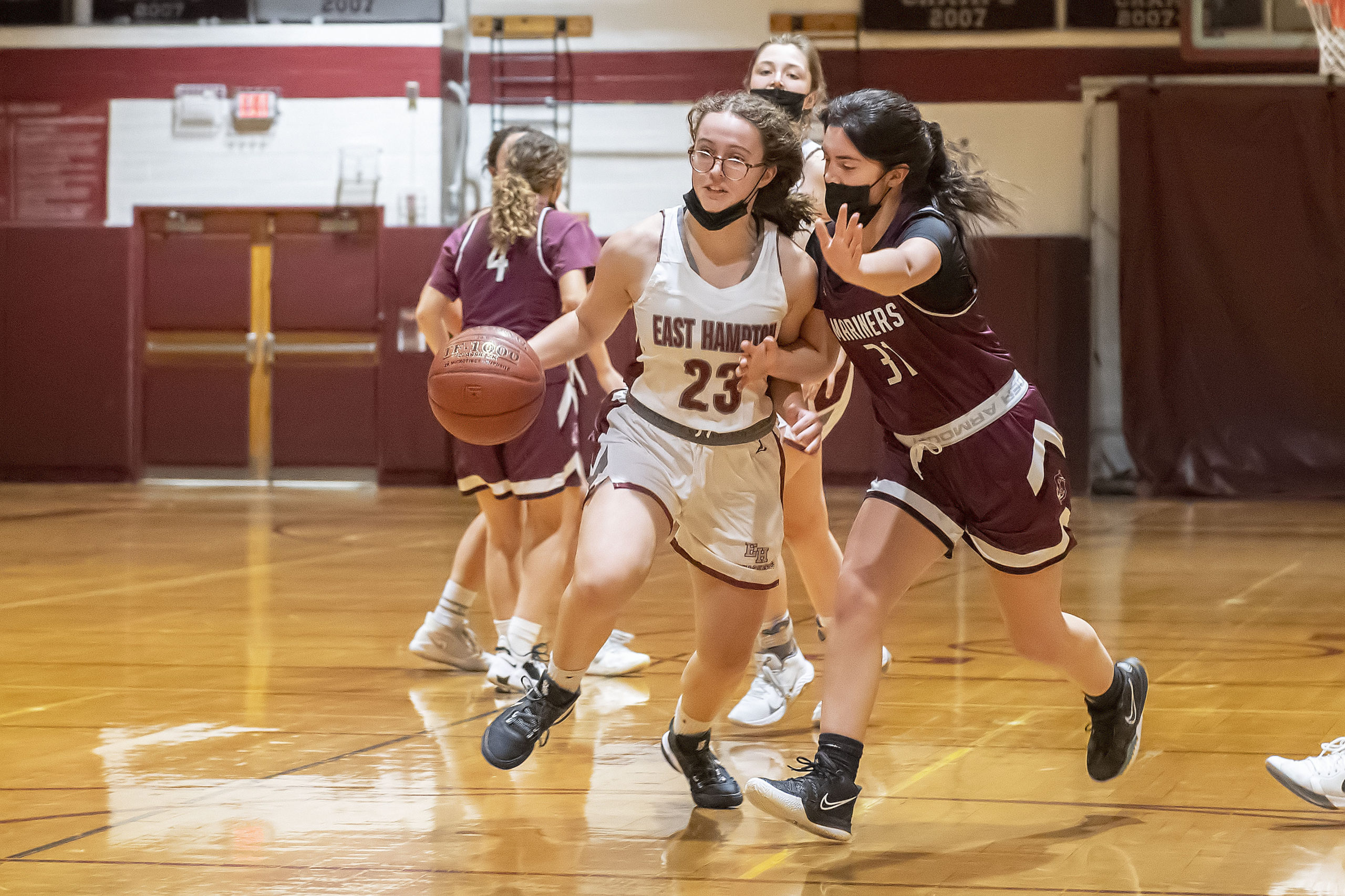 East Hampton's Chloe Swickard is pressed hard by Southampton's Celia Ginsberg.