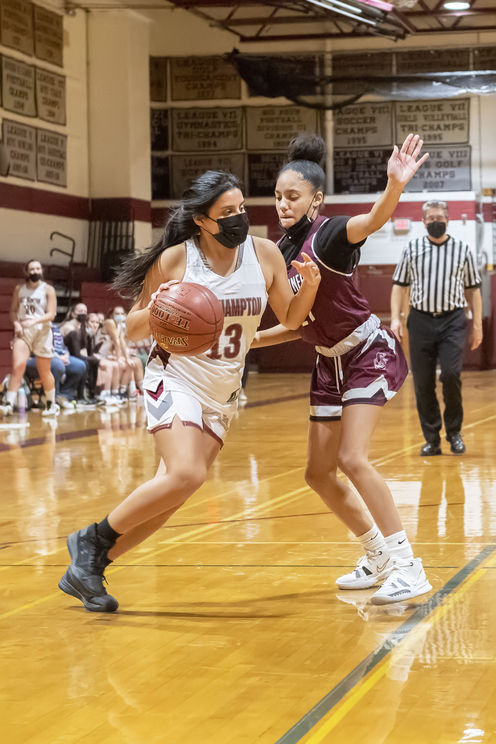 East Hampton's Jocelyn Prieto fends off Southampton's Daelyn Palmore to get to the hoop.